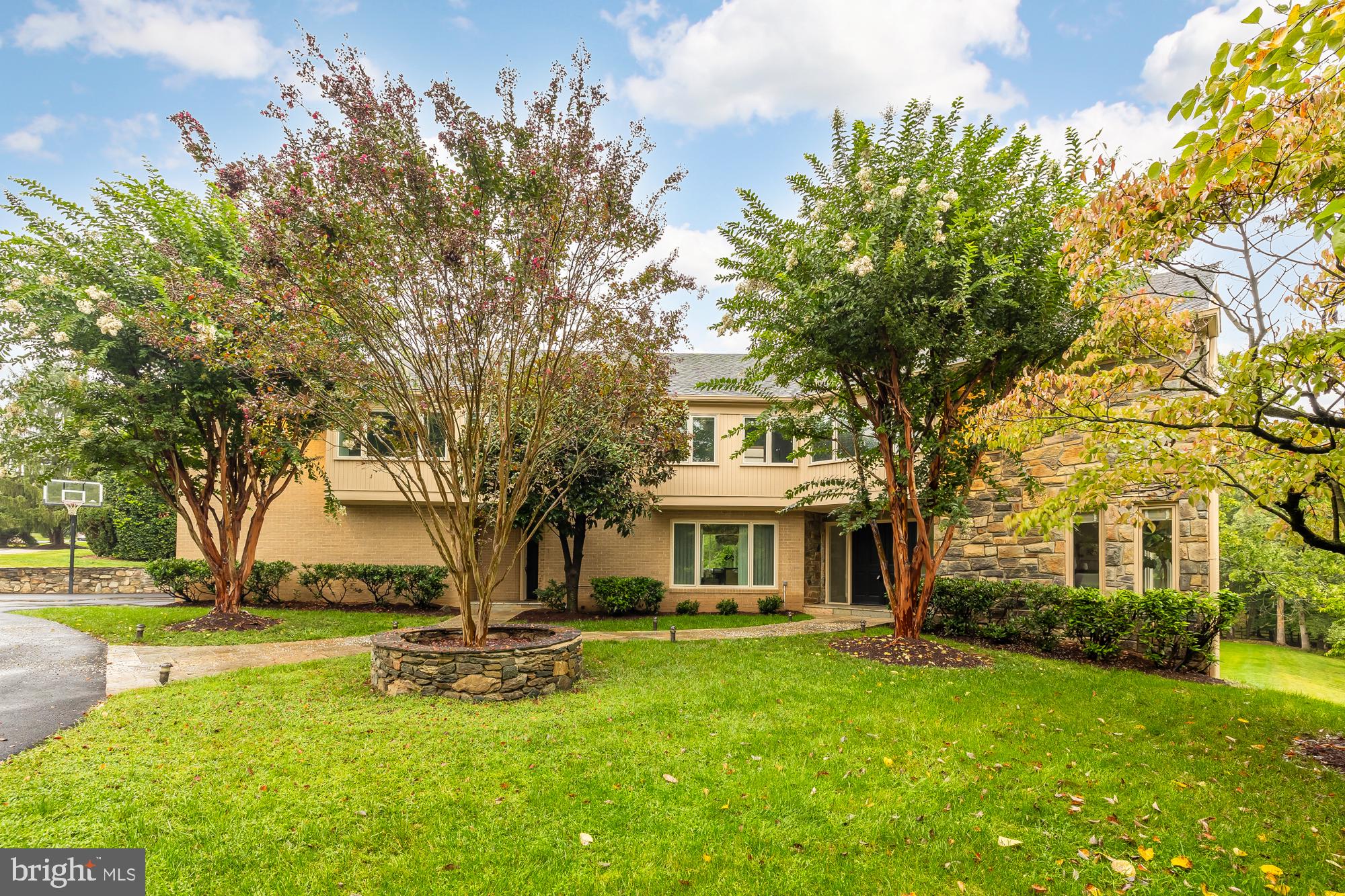 Welcome to 10029 Sorrel Avenue, a stunning contemporary residence offering luxurious living and an exquisite backdrop for high-style entertaining with over 7000 sqft of living space. Nestled in the prestigious Potomac Village, this home is framed by beautiful crape myrtle trees, a circular driveway, and a stone path leading to two front entrances.

As you step inside, the open floor plan immediately impresses with soaring ceilings and newly refinished hardwood floors. The main entrance opens to a dramatic two-story marble foyer, illuminated by four expansive skylights and a stunning modern staircase. The sun-drenched living room, with its floor-to-ceiling windows, features a luxurious lounge area complete with a fireplace.

The updated eat-in kitchen is a chef’s dream, featuring a center island, pantry, and an abundance of cabinets. The elegant dining room includes a wet bar alcove, perfect for entertaining. Gather around the brick fireplace in the inviting family room, which also boasts floor-to-ceiling windows and opens onto a spacious deck. This level also includes a home office, powder room, and a large laundry room and a second rear staircase to the upper level.

Upstairs, the primary bedroom suite is a true retreat, featuring two expansive walk-in closets and an en-suite bath with a separate tub and shower, double vanity, and private commode area. Bedroom two includes a walk-in closet, an additional closet, and a renovated en-suite bathroom. Bedrooms three and four share a double sink bathroom, and the upstairs hall concludes with a study area/lounge nook overlooking the kitchen.

The enormous finished basement is designed for versatility and entertainment, showcasing a playroom, full bath, office/study/gym, entertainment room, pool table area, walls of closets, and a huge storage area with a workbench. This floor's exterior door opens onto a stone patio, hot tub, and a firepit overlooking a gorgeous yard. The garage includes an electric car charger.

The level, cleared, grass lot is perfect for adding a pool, sports court, or tennis court. Perfectly located near Potomac Village's shops and restaurants, this home offers easy access to downtown DC, Bethesda, and area airports.

Experience the epitome of sophisticated living at 10029 Sorrel Avenue. Schedule your private tour today!