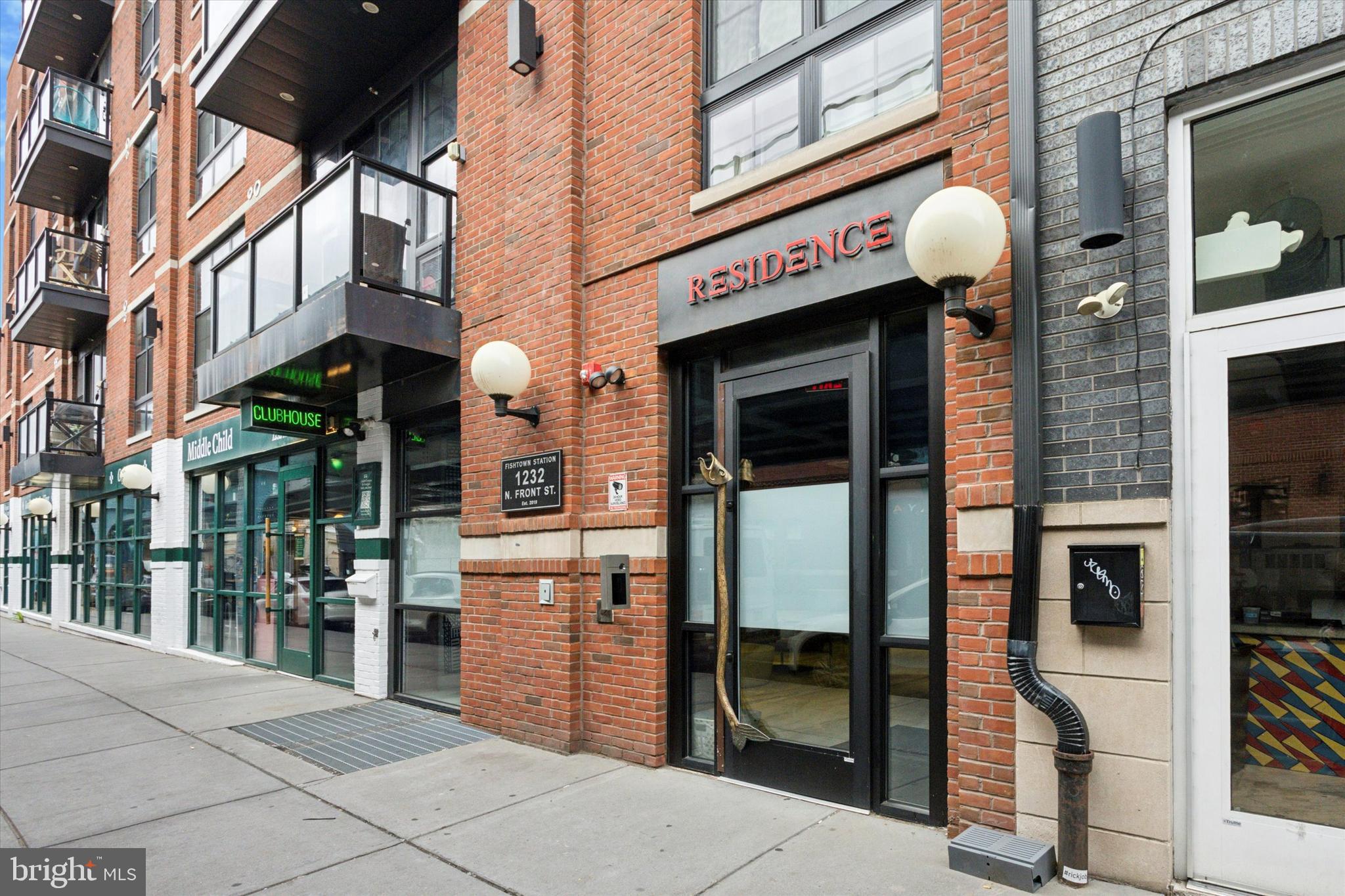 What luck! This is your chance to rent a gorgeous 2 bed 2 bathroom condo with a MASSIVE DECK- right in the true threshold of Fishtown! This open concept flat is single floor living at its finest. Via secure entry, access the second floor by elevator and enter into your oversized unit finished with white oak flooring, recessed lighting and floor-to-ceiling windows throughout. Notice a convenient coat closet and separate laundry closet en route to the living quarters- where an oversized living area abounds with natural sunlight that seamlessly flows into the high-end kitchen. From the waterfall edge quartz island, to the stainless GE appliances (including gas range), to the fresh shaker style cabinets with black hardware- this is a kitchen worth showing off! While you're at it, be sure to invite your guests out onto your gigantic PRIVATE deck- perfect for entertaining, playing with the pup, or just some quiet r&r. Two generous sized bedrooms await you back inside- of which, the (particularly large) primary features a huge walk-in closet and en-suite bath w/double vanity and natural light. The second bedroom, which is complete with a double-wide closet and is large enough for a king-sized bed, also makes for a wonderful guest room/office combo, nursery, etc. The second full bathroom is conveniently located off the guest room, and this wing is rounded out by a large utility/ storage closet. Literal steps away from Pizzeria Beddia, LMNO, Front St Cafe, Mulherin & Sons + NEIGHBORS to Middle Child Clubhouse and 1-900-Ice Cream... Minutes to the El Subway station, Northern Liberties and ALL that Frankford Ave and booming Fishtown has to offer... Could you even ask for a better location?!