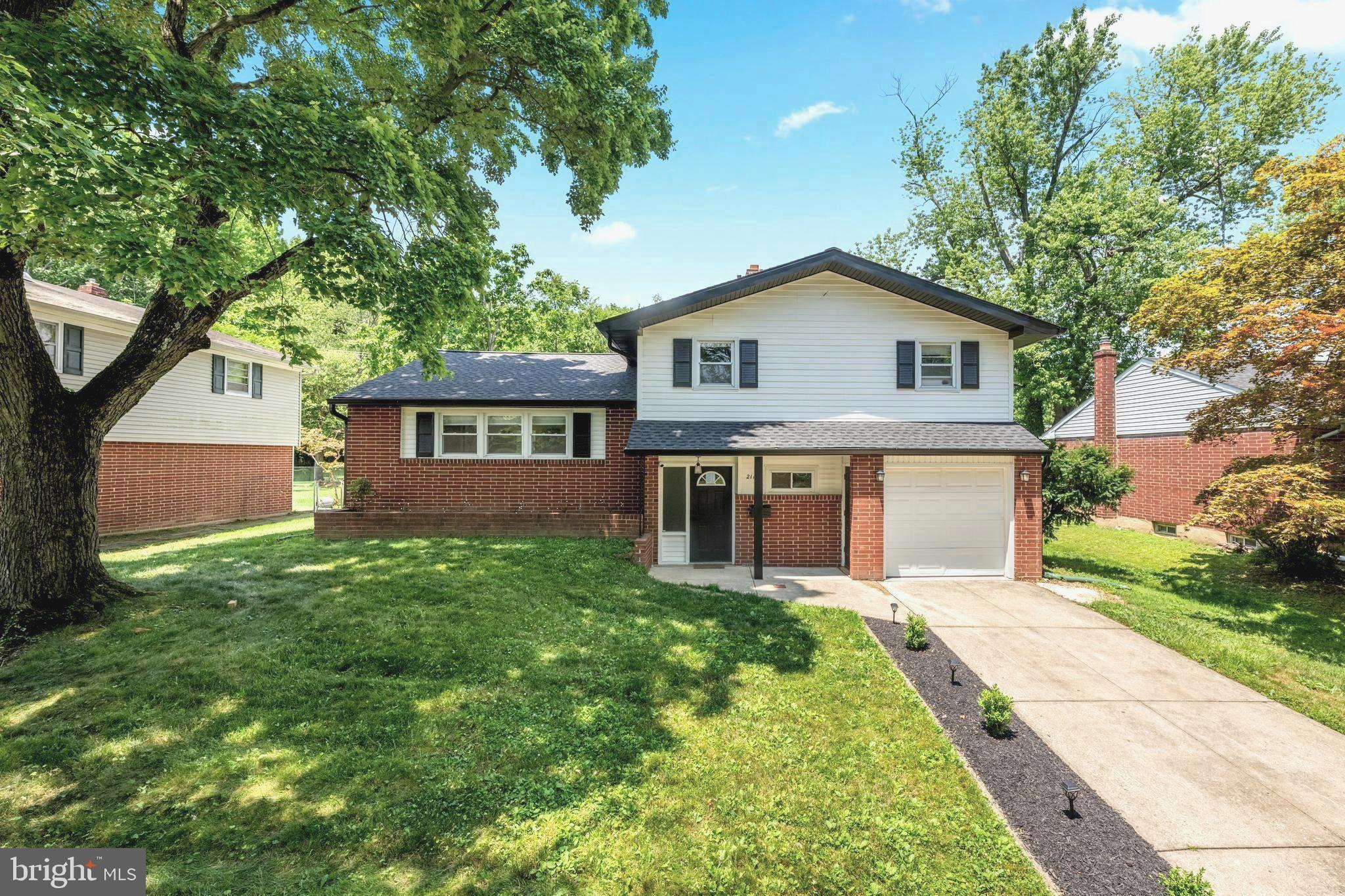 Roof? New — 2025. Kitchen? Renovated — 2023. Electrical? Upgraded — 2023. The expensive stuff is already done — all that's left is moving in. • • •

Welcome home to 2115 Westminster Drive in North Wilmington's sought-after Holiday Hills — a fully reimagined split-level on a peaceful, tree-lined street. Step inside to a sun-filled living room with vaulted ceilings and recessed lighting, flowing into a showstopping open-concept kitchen: Quartz counters, marble backsplash, soft-close cabinetry, gas range with extra broiler, and brand-new stainless appliances (2023).
Upstairs, the primary suite features a brand-new floor-to-ceiling tiled shower and designer Kohler fixtures, plus two more generous bedrooms and a fully renovated full bath. The lower level adds a possible 4th bedroom/office, renovated powder room, laundry room, and a garage with new door, floor, and opener.
Outside, enjoy an oversized porcelain-paver patio and a fully fenced yard with a new (2024) 6-ft vinyl privacy fence.
And the big stuff is done: full roof replacement with new plywood and a transferable warranty, oversized gutters, and new soffits & fascia (2025), plus upgraded attic insulation, a newer washer/dryer (2023), an upgraded electrical panel (2023), all-new doors, fresh paint, and seamless LVP flooring throughout.
Style, comfort, and long-term value — minutes from major routes, shopping, dining, and parks. Schedule your showing today.
