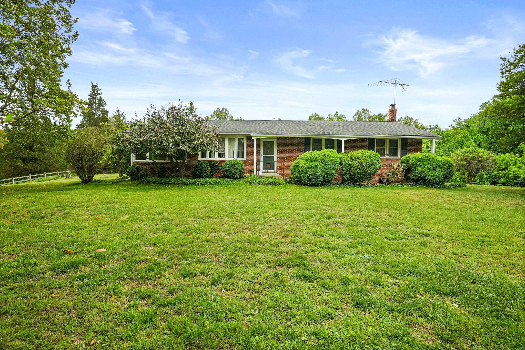 Private and secluded rancher situated on a beautiful 4.54 total acres, which includes two adjacent lots: Tax ID 17151780089 and Tax ID 17151780105. This well-maintained all brick 3 bedroom, 2 full bath home offers a great opportunity for a buyer to add their own updates and personal touch.

The main level features an open living with large bay window and dining room with hardwood flooring throughout, a spacious sunroom off the side of the home, and a kitchen with plenty of room for cooking and an eat-in table. The home also includes three generously sized bedrooms, a hall bath, and a primary bedroom with ensuite bath. The sunroom opens to the lush backyard and is the ideal spot for relaxing, nature watching and gathering with family and friends. 

The  expansive unfinished walk-up basement offers excellent potential for additional living space and includes the laundry area and with stairs leading to the backyard. Major updates include furnace replaced in 2016, heat pump in 2015, and roof in 2009. Home also includes a water softener. Property is being sold as-is. All this located in a tranquil setting that makes you feel miles away from the hustle and bustle yet is so close to major routes, shopping, dining and entertainment options.