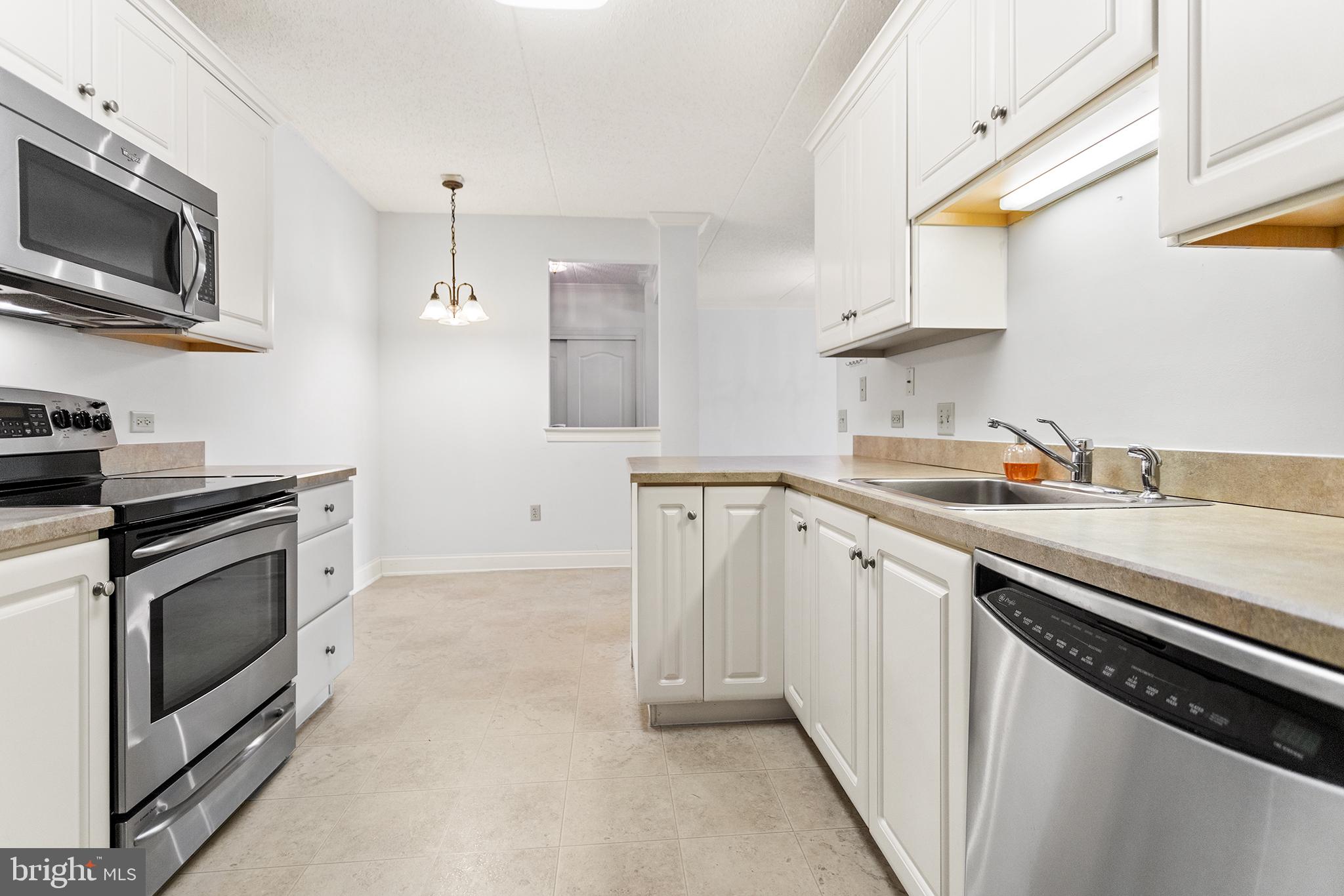 Wonderful opportunity to own in the sought after 55+ community of Windsor at Glen Mills.  This 2 bedroom, 2 bathroom unit is ideally located on the third floor, overlooking the community pool & open space. Convenient one floor living features a semi-open main living space. The dining/living room has plush wall to wall carpet and stretches straight through to the sliders that open to the covered patio. The updated eat-in kitchen is highlighted with stainless steel appliances, lots of cabinets and a breakfast bar, plus access to the in-unit laundry/pantry. The primary bedroom is drenched in natural light, has a huge walk-in closet and en-suite bathroom with accommodations including a single threshold shower stall. The secondary bedroom has a tray ceiling, plush wall to wall carpet and spacious closet. A hall bath sits just outside this bedroom.The unit also comes with a storage unit in the garage!  Amenities in Windsor include a community outdoor pool, central lobby, fitness center, craft room, computer room, billiard room, library and community room. Association fee covers exterior maintenance, parking, snow removal, and amenities. Ideally located between Glen Mills and Media with tons of shops, restaurants and green space. Minutes to multiple Septa stations, less than 30 minutes to the Philadelphia International Airport.