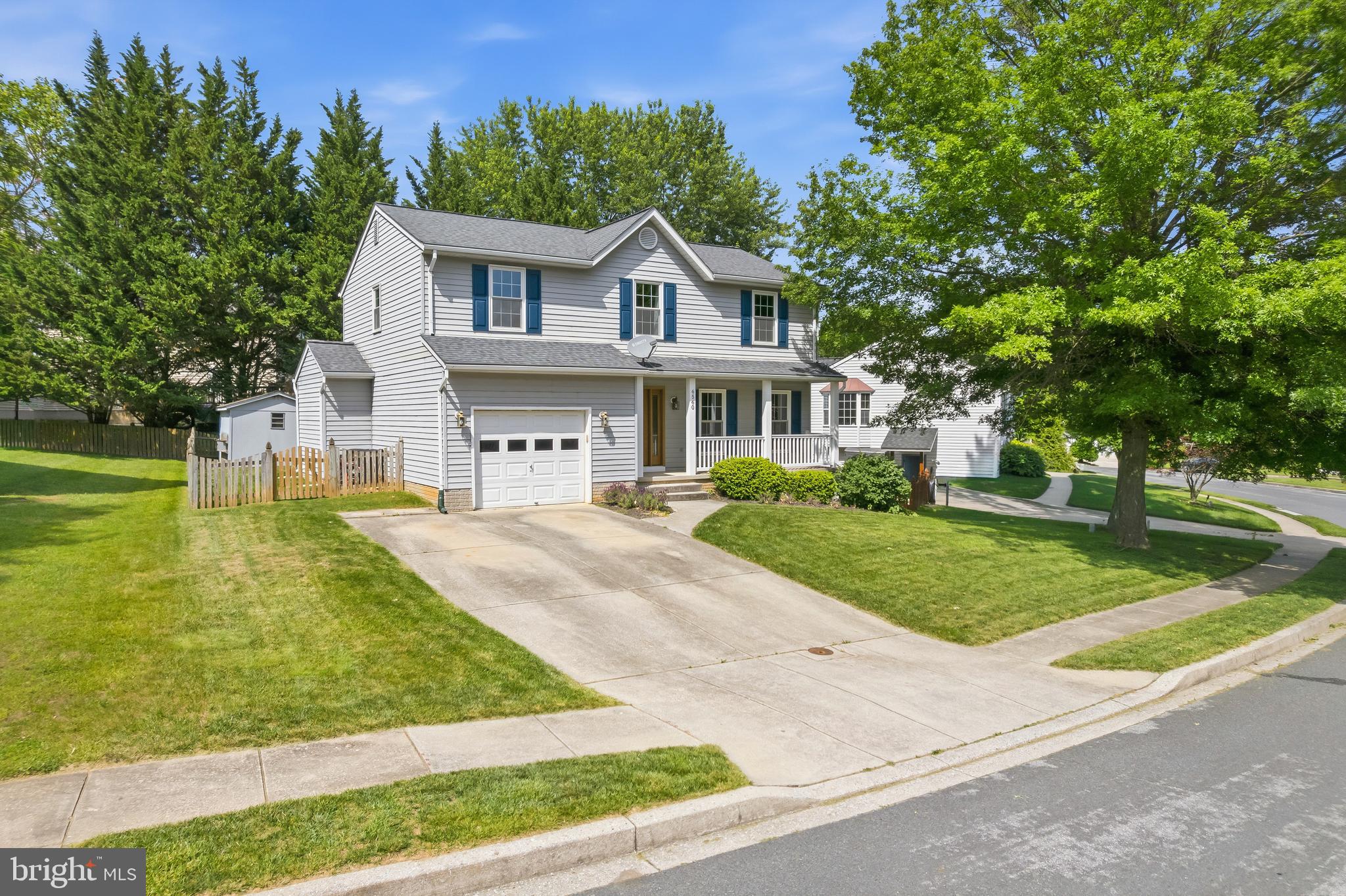 This charming porch-front colonial home is located on a private cul-de-sac street in the desirable Benjamins Claim subdivision in Eldersburg and is situated on a beautifully landscaped fenced lot. Step inside to discover a perfect blend of comfort and well-designed functional living space with four spacious bedrooms and two-and-a-half ceramic bathrooms. The lovely home offers a bright traditional floor plan with formal living and dining rooms, enhanced by elegant chair railings. The eat-in kitchen is fully equipped with ample oak cabinetry, stainless steel appliances, ceramic tile floors, and a breakfast nook area bathed in natural light from the large bay window. The adjoining family room boasts a cozy gas fireplace with an oak mantel, as well as provides access to the fabulous stamped concrete patio with built in benches that overlook the fenced back yard, complete with a shed. The second level houses the primary suite featuring hardwood flooring, a walk-in closet, skylight and a ceramic bathroom. Completing the second level is another ceramic bathroom and three additional spacious bedrooms, all equipped with a ceiling fan with lights. The partially finished basement offers additional space featuring a recreation room, an office or 5th bedroom, and a huge storage / utility room equipped with a full-size front-loading washer and dryer, utility sink and plenty of storage shelves. The basement also provides peace of mind with a drainage system and a sump pump. Outside, the property is beautifully landscaped with mature trees and extensive hardscaping, providing a serene outdoor retreat. The attached 1-car garage and driveway accommodate multiple vehicles. Major improvements to the property include new kitchen appliances, water heater,  circuit breaker panel & HVAC system in 2025, new Thompson Creek windows & gutter helmet in 2024, and in 2018 a new 50 year architectural shingle roof & patio. The Benjamin's Claim community is served by natural gas, public water and sewer. Enjoy easy access to solid schools, Freedon Park, tennis courts, sports fields, and miles of paved walking / running / biking paths. The home is conveniently located to plenty of shopping, dining, and entertainment options, Baltimore, Frederick and Annapolis, in close proximity to BWI, NSA, NASA, MARC rail and major transportation routes. Come visit the Open Houses on June 13th and 14th from 1-3 PM.