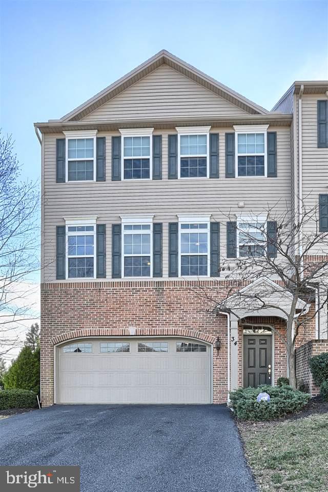 Lovely upscale end unit in Copper Ridge with numerous upgrades. Beautiful hardwood & tile floors, granite counters & deck overlooking trees. Master suite with tray ceiling, WIC, bath with jetted tub & separate shower. Finished first floor bonus room with walk-out to patio & RI for bath. 2 car garage with shelves. Cul-de-sac setting with privacy. Great neighborhood location. OPEN SUNDAY MARCH 20TH FROM 1:00-3:00.