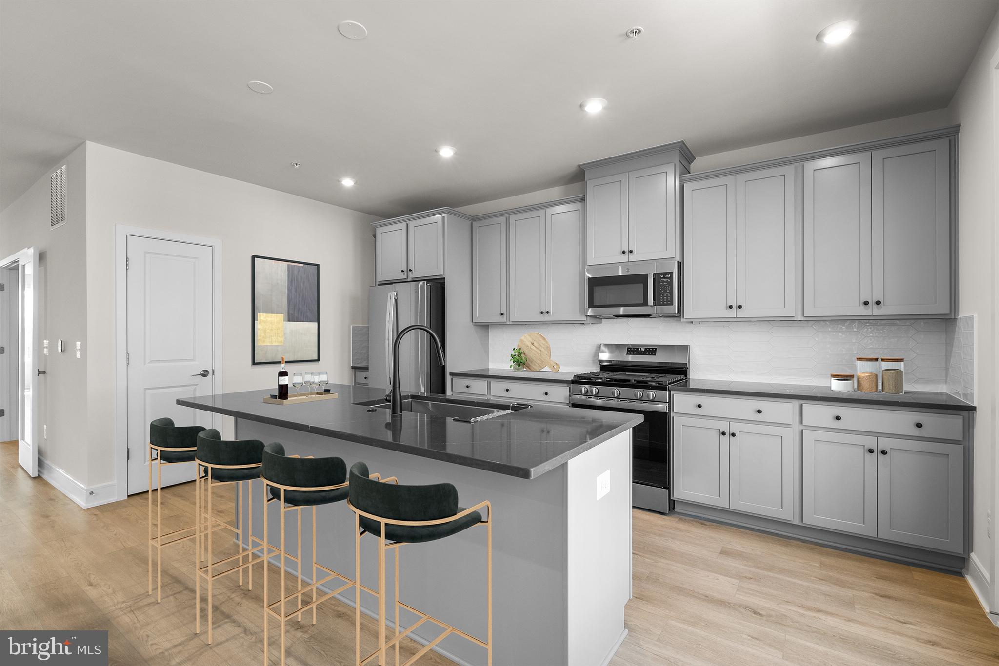 Introducing one of the latest gems from Van Metre Homes — the BLUEMONT floorplan! Conveniently located and meticulously crafted, this brand-new incredible TOWNHOME-STYLE CONDOMINIUM by Van Metre Homes at DEMOTT & SILVER is  available for you to call home JANUARY 2025! Boasting 2,753 finished square feet across two levels and featuring 3 bedrooms and 2 full and 1 half bathrooms, this home offers a luxurious yet practical lifestyle. As you step inside, the main level beckons with a well-designed open floor plan starring 9' ceilings, an expansive great room, a private study, and the piece-de-resistance— a modern kitchen that exudes innovative elegance. Upgraded cabinets, quartz countertops, stainless-steel appliances, and wide luxury vinyl plank flooring adorn the kitchen, creating an inviting ambiance for both everyday living and entertaining. Ascend to the upper level and indulge in the lavish primary suite, complete with two walk-in closets and a luxurious 5-piece bathroom boasting dual sinks, an impressive soaking tub, and an oversized frameless shower. The two additional bedrooms and full bathroom and convenient upstairs laundry are perfectly suited to meet your needs and complement your lifestyle. Additionally, this residence includes an attached 1-car garage, providing both security and convenience for your vehicle. Experience the best of both worlds with this designer-curated home, which combines the spaciousness of a townhome with the low-maintenance, easy lifestyle of a condominium. And being a new build, your home is constructed to the highest energy efficiency standards, comes with a post-settlement warranty, and has never been lived in before! Don't miss your chance to elevate your living experience in this exceptional residence. Schedule your appointment today and make your dream home a reality! ----- Discover Demott & Silver, Van Metre’s exceptional community of townhomes and townhome-style condominiums nestled within the master-planned Broadlands community. This sought-after neighborhood offers unparalleled convenience with walking distance access to Metro’s Silver Line and the area’s most desirable amenities. Residents relish in a host of top-notch amenities across Broadlands, including a clubhouse, fitness center, three pools, tennis courts, vast green spaces, and extensive hiking and biking trails. With shopping, restaurants, Metro’s Ashburn Station, a bus stop, and nearby commuter routes at your fingertips, Demott & Silver is set to become the epitome of a superior community in Broadlands. ----- Take advantage of closing cost assistance by choosing Intercoastal Mortgage and Walker Title. ----- Other homes sites and delivery dates may be available. ----- Pricing, incentives, and homesite availability are subject to change. Photos are used for illustrative purposes only. For details, please consult the Community Experience Team.