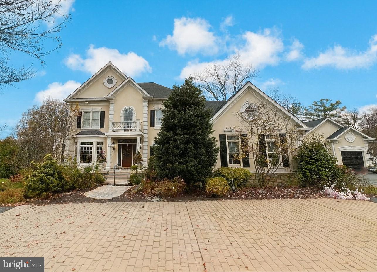 This one-of-a-kind custom-built estate, tucked into a private half-acre lot, is ideally located just minutes from I-66, Oakton, and Old Town Fairfax. This exceptional home offers a rare blend of architectural character, scale, and modern upgrades in the sought after Cobbdale Neighborhood.  The main-level primary suite is a true retreat, featuring a lighted tray ceiling and a fully renovated, spa-inspired primary bedroom and bathroom completed in a $200,000 upgrade. Throughout the home, you’ll find soaring ceilings, elegant plaster moldings, custom wrought-iron railings, and impressive floor-to-ceiling windows that flood the living spaces with natural light.  The gourmet kitchen features 2 dishwashers, double ovens (one convection), stunning paneled cupula ceiling, granite island with both gas and electric cooktop. The breathtaking kitchen opens to a bright breakfast room and an expansive family room with a gas fireplace - perfect for entertaining or relaxing in style. Major improvements include 95% brand-new windows ($150,000), an updated central vacuum system, and a roof replaced just 5 years ago, providing peace of mind and long-term value.  In addition to the attached garage, the property also features an oversized detached 2-car garage with it's own separate electrical panel, a huge 10x20 (approx) workshop space of the back, with custom cabinets in both garages...a dream come true for car enthusiasts, hobbyists, or additional storage.  This is a rare opportunity to own a truly distinctive luxury home in a premier Northern Virginia location. This is the one!