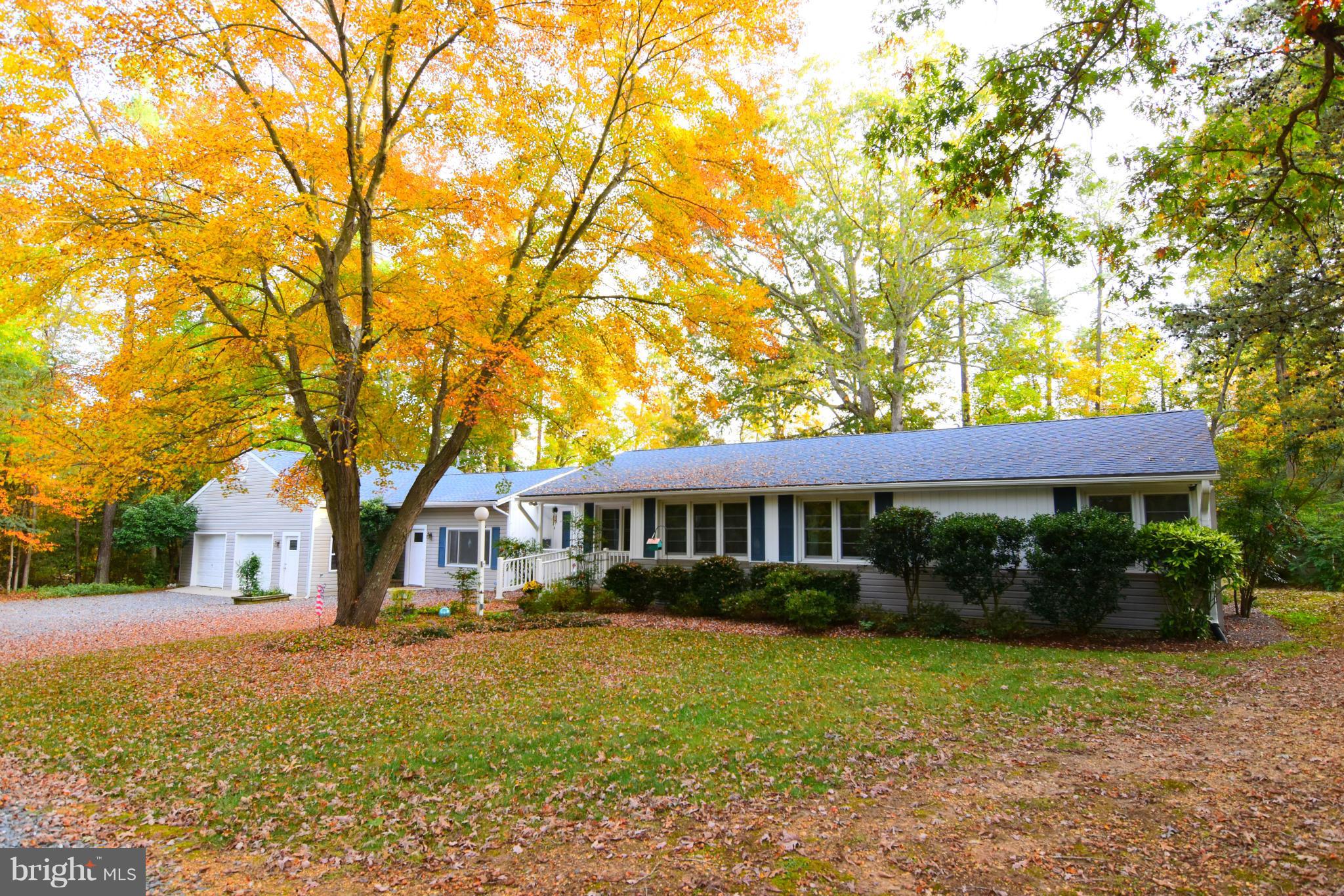 This home has had many renovations &  large garage addition.  Windows & siding in 2002., roof in 2013, AC in 2012, Furnace in 2010. Remodeled kitchen & baths.  Hardwood floors.  Efficiency apartment or home office with separate entrance. 30 x 24 garage & 18x15 shop, both have insulated walls & gas heat.  Main house has oil furnace.  Gas cooking, gas fireplace. 2 decks.  Private back yard.
