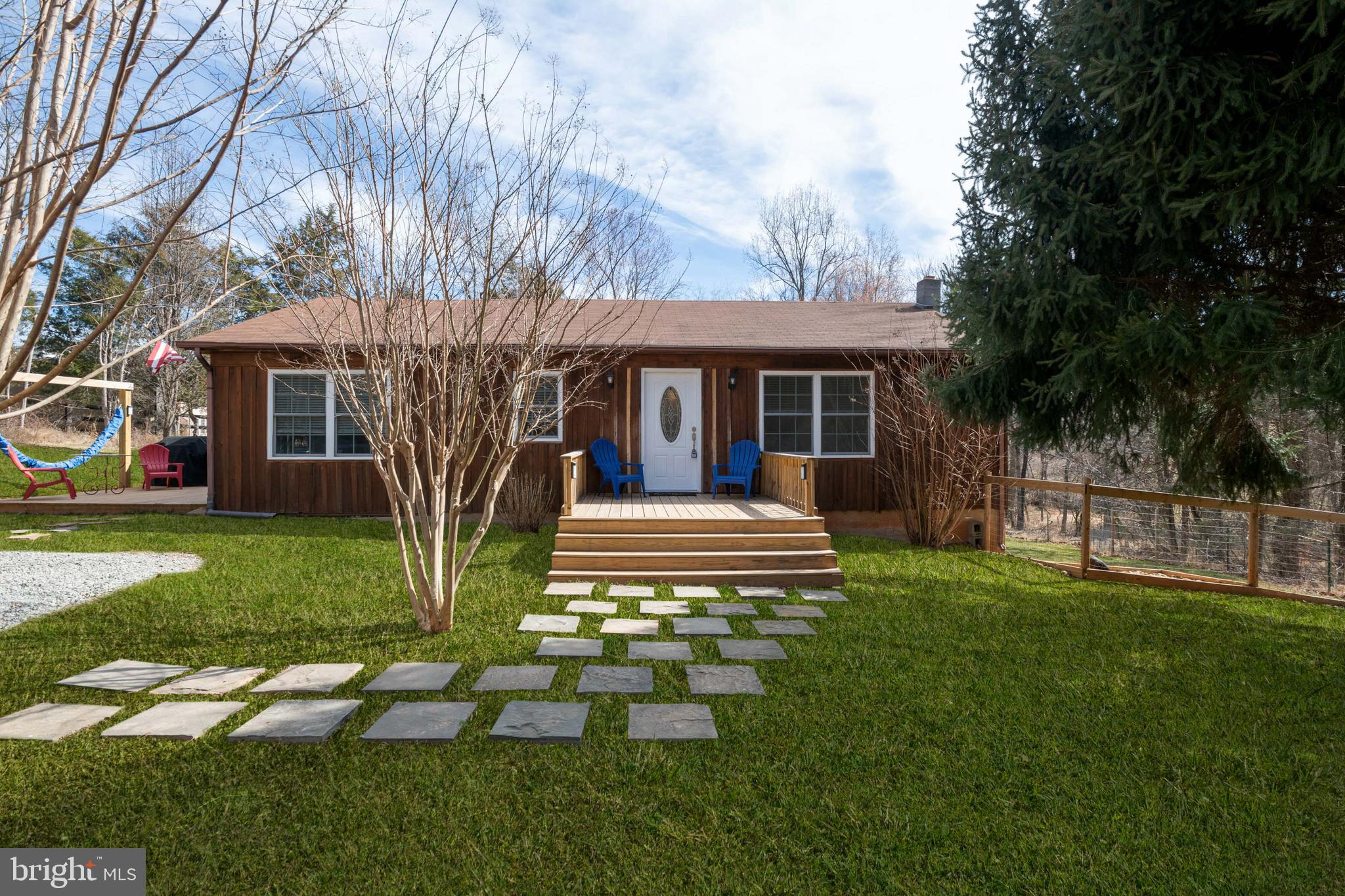 IT'S GOOD TO BE HOME!  Relaxing on the front porch overlooking the soon to be blooming Crepe Myrtles with privacy abundant. Main level living  in the country  on the DC side of Warrenton for easy commuting.  Eat in Kitchen,  with lovely Luxury Vinyl Plank flooring extending into the large Family room and Foyer. Kitchen has Corian counter tops.  3 bedrooms  with Pine hardwoods. Large patio off the Family room with a fire pit.   Lots of natural light with all the windows throughout the home.  Fenced rear yard  with doggie door into the basement. Basement is 832sqft. total.  Large Shed with electricity.  Comcast & Verizon available.   Woodstove does not convey. Please follow all COVID recommendations.  Wear a mask, cover your shoes, leave all lights on.