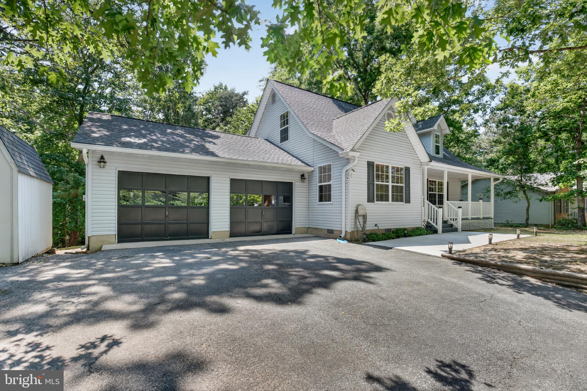 **Meticulously Maintained Cape Cod with Exceptional Storage & Community Amenities**
Proudly offered by the original owner, this beautifully maintained 1888 sq ft  3-bedroom, 2.5-bath Cape Cod combines quality craftsmanship, thoughtful design, and everyday comfort. The open floor plan features spacious rooms, hardwood flooring throughout both levels, and six ceiling fans with remote controls for year-round comfort.
Designed with organization in mind, the home offers abundant storage throughout, including attic storage in both the main house and attached 2-car garage. The garage is equipped with built-in and freestanding storage cabinets, providing plenty of space for tools, hobbies, and seasonal items. An outdoor shed offers even more space for your personal storage.
Energy-efficient features include Low-E double-pane windows, additional insulation in the attic and crawl space, and a well-maintained mechanical system that reflects years of attentive ownership. The home has been recently painted and professionally cleaned. Move-in ready condition!
Enjoy the benefits of living in a desirable community with quick access to Lake Lariat, community beaches, and a private airstrip available for resident use. Conveniently located near schools, shopping, restaurants, and recreational opportunities, this home also offers an easy commute to NAS Patuxent River, Joint Base Andrews, and the Washington, D.C./Baltimore metropolitan area.
A rare opportunity to own a lovingly cared-for home that offers comfort, storage, efficiency, and an exceptional location. Quick settlement possible!