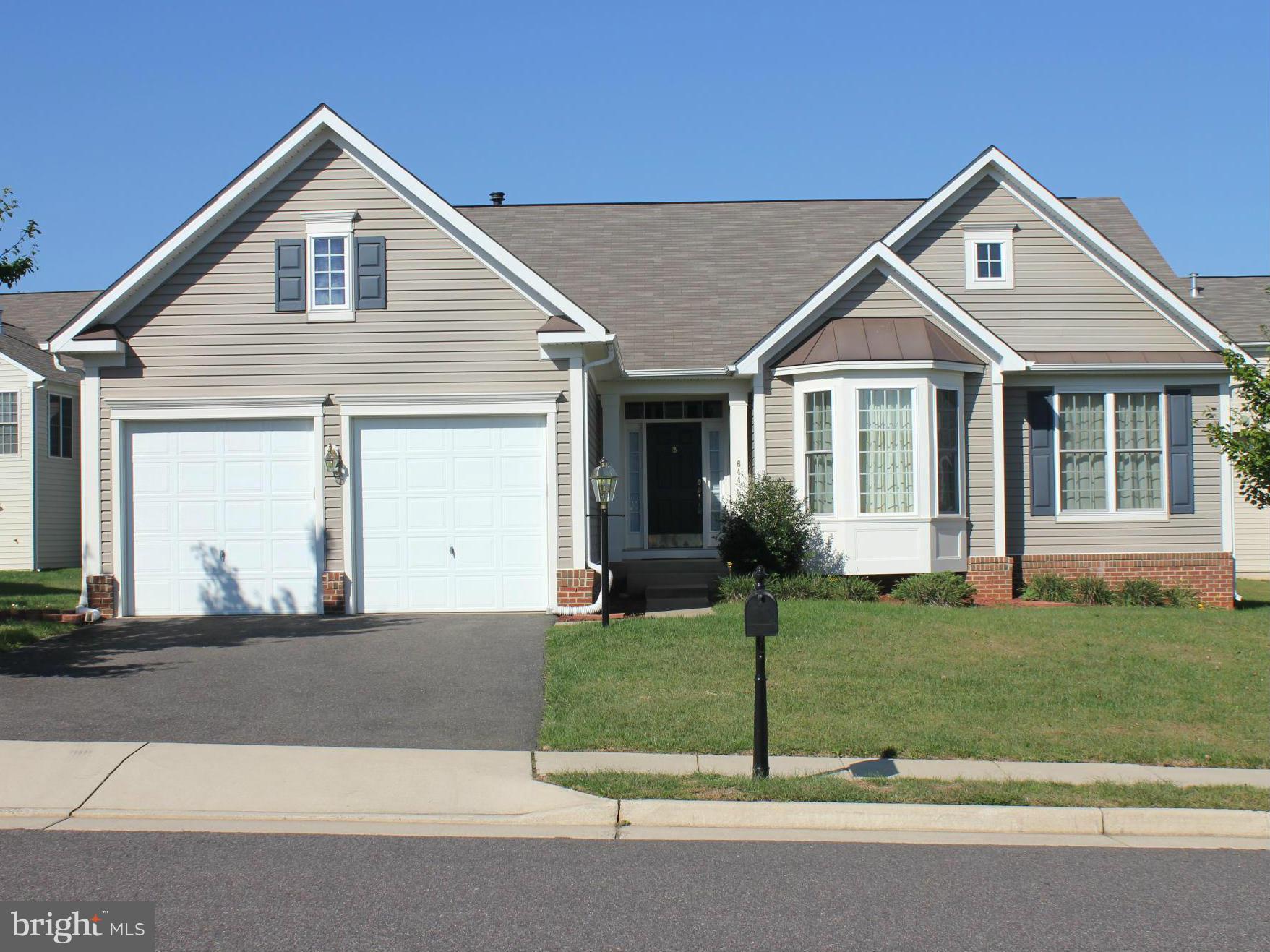 JUST REDUCED! Beautiful Rambler Shows Like New! One Level Living at it's Finest.  Home is Open and Inviting.  Amenities: 9' Ceilings, Vaulted Ceilings In MBR & LR, Granite Kitchen Counters, 42" Cabinets, Bays, Stone FP in LR.  Master Bath Features Double Sinks, Jacuzzi Tub, Separate Shower. Basement recently finished with RR, Den/Office, FBA, Storage.