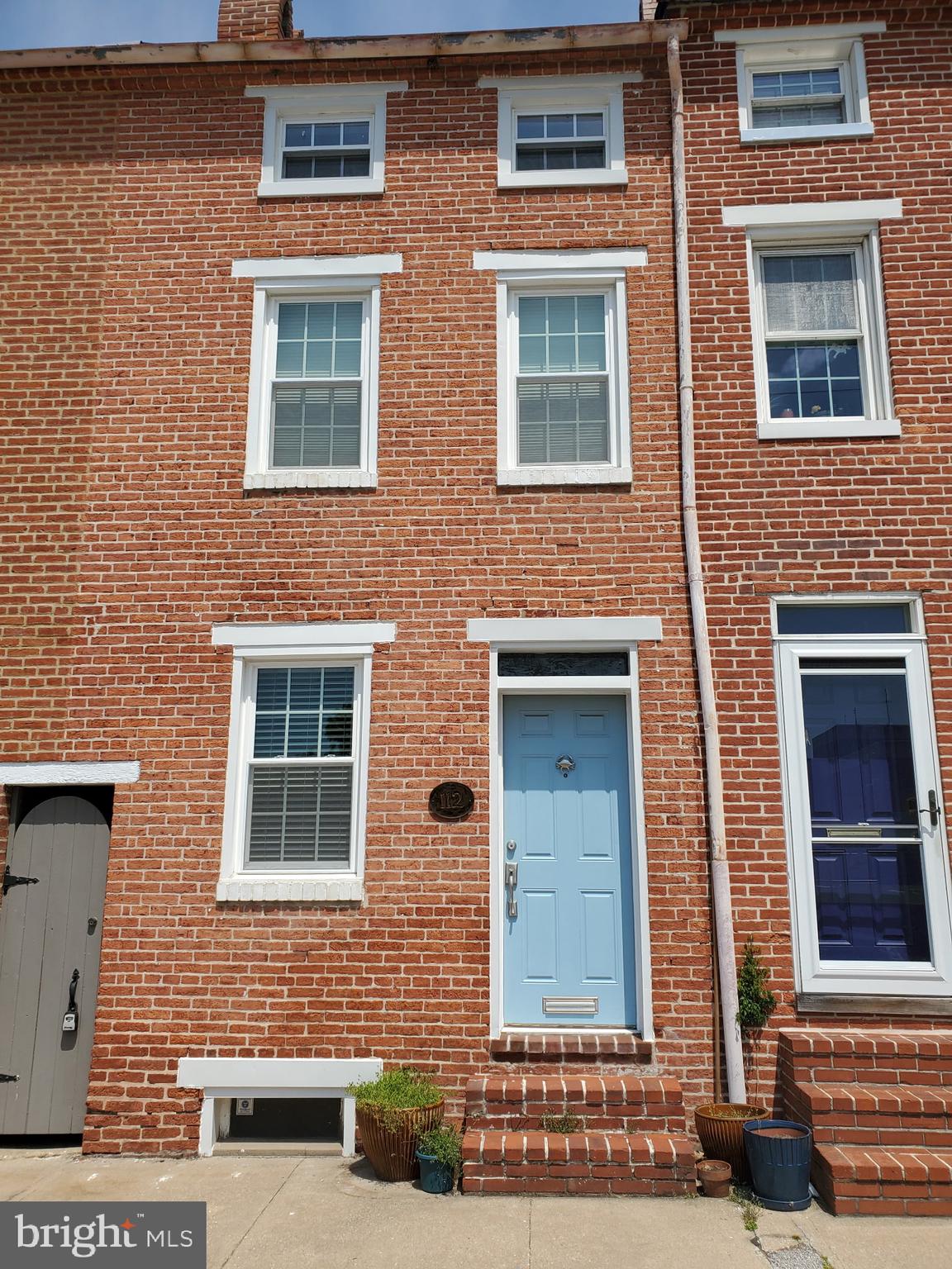 Welcome to this beautifully maintained brick home in the heart of Federal Hill, perfectly blending classic Baltimore charm with modern convenience, including an off-street parking pad. From the moment you step inside, you’ll fall in love with the warm character of exposed interior brick—adding timeless style and a cozy, inviting feel. The living room and bedroom feature stunning tin ceilings and charming brick fireplaces, enhancing the home’s unique character and historic appeal. This home features three bedrooms, a living room, and a separate dining room—perfect for entertaining or everyday living—while the basement includes a washer and dryer for added ease and storage. Step outside to enjoy a private backyard, ideal for relaxing, entertaining, or creating your own outdoor space. The off-street parking pad adds an extra level of convenience, making city living that much easier. Perfectly situated just a few blocks from schools, the Inner Harbor, Federal Hill Park, and Cross Street Market, you’ll have easy access to shopping, dining, and entertainment options. Commuters will appreciate the close proximity to major routes, including Interstate 95, Interstate 695, and the Baltimore-Washington Parkway. This home offers the perfect combination of charm, space, and walkability. Schedule a tour today!
