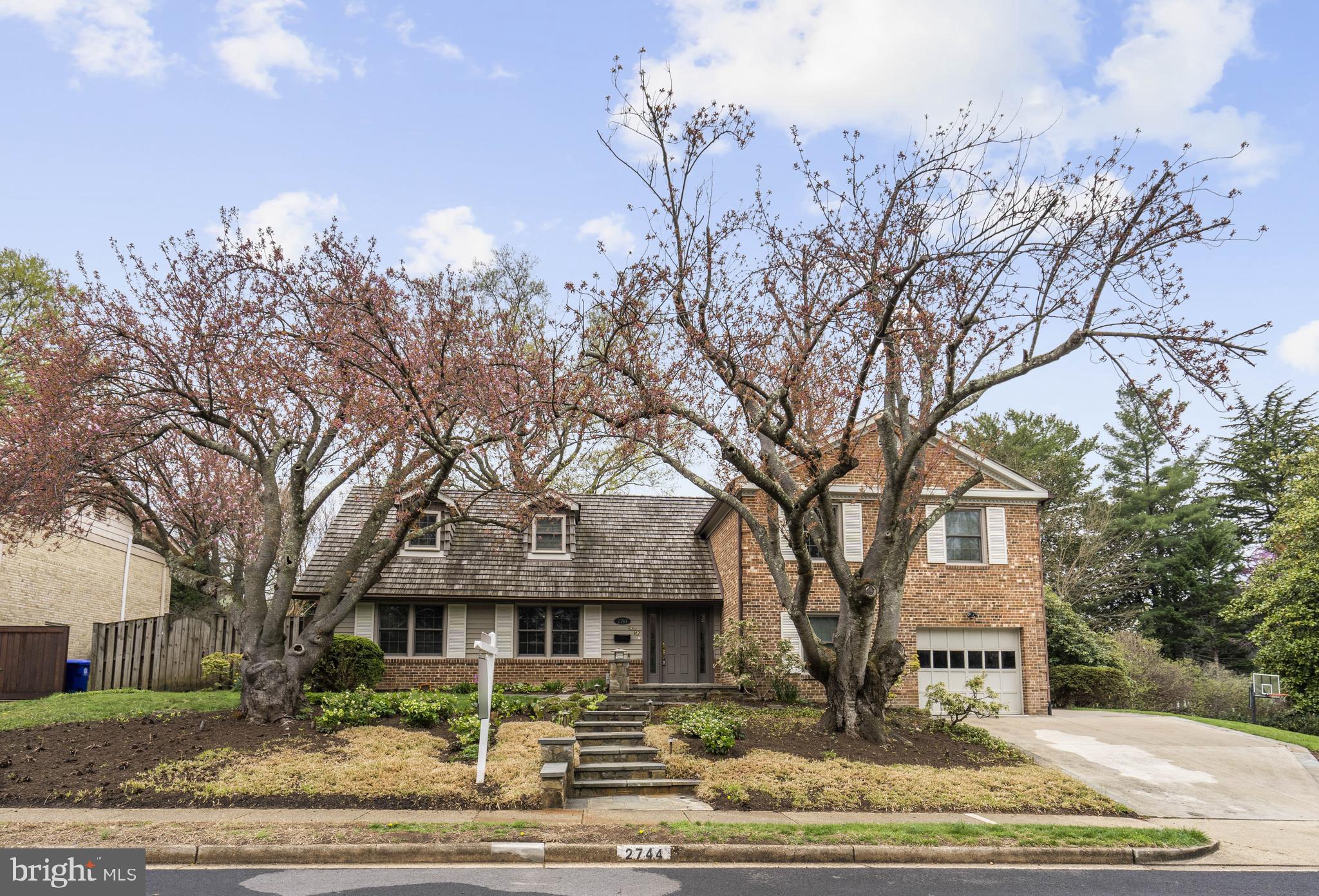 Welcome to this beautifully updated home North Arlington, offering more space than it appears at first glance! With over 4,000 sq ft, it has 5 Bedrooms, a home office, eat-in kitchen, living room, dining room, family room, screened porch, and a large unfinished basement - you won’t believe the amount of space. The bright and airy floor plan is flooded with natural light, highlighting the modern updates throughout. There are 4 ample sized bedrooms and 2 updated full bathrooms on the upper level, and the primary suite has an attached office or den.  Enjoy cooking in the large, bright, stylish kitchen with contemporary finishes, stainless steel appliances, large pantry and table space. The main level features a tucked away 5th bedroom staged as a home office with a half bath that has plumbing roughed into the closet should you want to extend the powder room to add a shower.  There is a walk out family room with wood burning fireplace and slider doors to a stone patio. Outside, you'll find extensive hardscaping and landscaping that include flowering perennials , maple and cherry trees, patios and a screened room. A gas generator and in ground sprinkler system make life easy! The home also includes a one-car garage and plenty of storage in the unfinished basement, which is currently used as a gym, laundry, and workshop. 
This special location is close to DC, yet steps away from wooded trails and nearby parks.  Take a short walk up a path to the Donaldson Run Pool, a community amenity available to owners in this neighborhood should you opt to join. The area is perfect for walking, running, biking or simply unwinding in your backyard and gardening. Located in the Dover Crystal neighborhood, you are close to shopping, schools, commuter routes and nature.  Commuting to Washington, D.C. or Tysons is a breeze with easy access to the GW Parkway and Rte 66 for just a short drive to downtown. Arlington Public Schools include Taylor Elementary, Dorothy Hamm Middle School, and Yorktown High School along with Arlington’s countywide options like Escuela Key, Arlington Traditional and Montessori.  This location is minutes away from the restaurants and shopping of Cherrydale, Clarendon and Ballston.  Please see the virtual 3D tour and floorplans - you won't believe how much space is in this charming home.