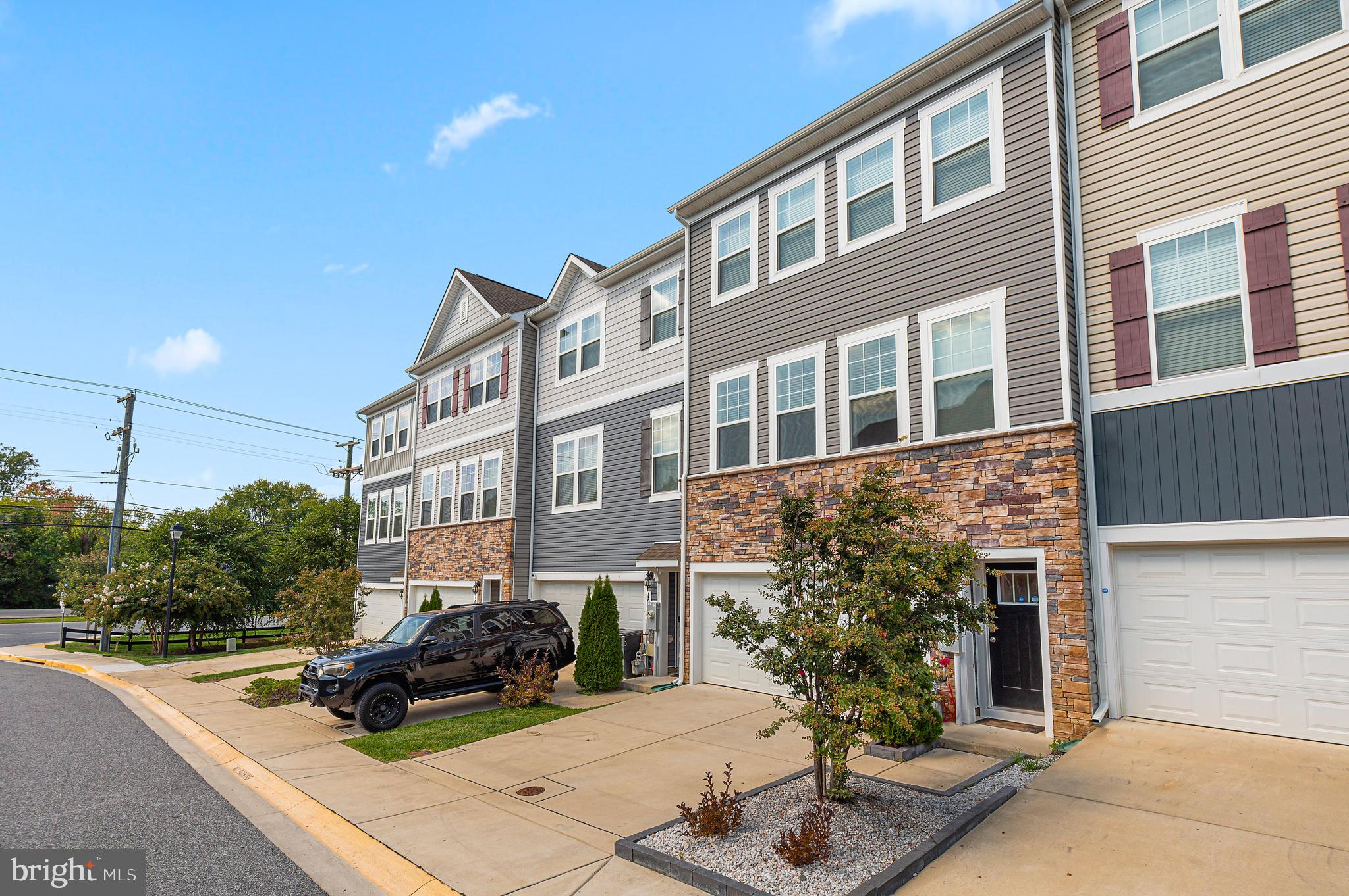 Discover a fantastic opportunity to own this gorgeous luxury garage townhome, thoughtfully upgraded on every level. The entry floor offers a beautifully finished space with private quarters ideal for visiting guests, game‑day lounging, or a quiet work‑from‑home retreat with direct access from the garage.

The main living level features an elegant open‑concept design with abundant upgraded cabinetry, a granite center island perfect for entertaining, and sleek black/stainless appliances that make cooking a delight. Separate dining and living rooms create a warm, inviting flow anchored by rich flooring throughout.

Step out onto the deck backing to peaceful woods and unwind with the soothing sounds of nature and your favorite beverage.

Upstairs, the spacious primary suite offers a relaxing end‑of‑day escape with an upgraded bath. Additional bedrooms are generously sized and served by a well‑appointed secondary bath.

This home truly will not disappoint — Your Journey Home Begins Here.  
Close to major commuter routes, Fort Meade, NSA, BWI, MARC train, shopping, and more.