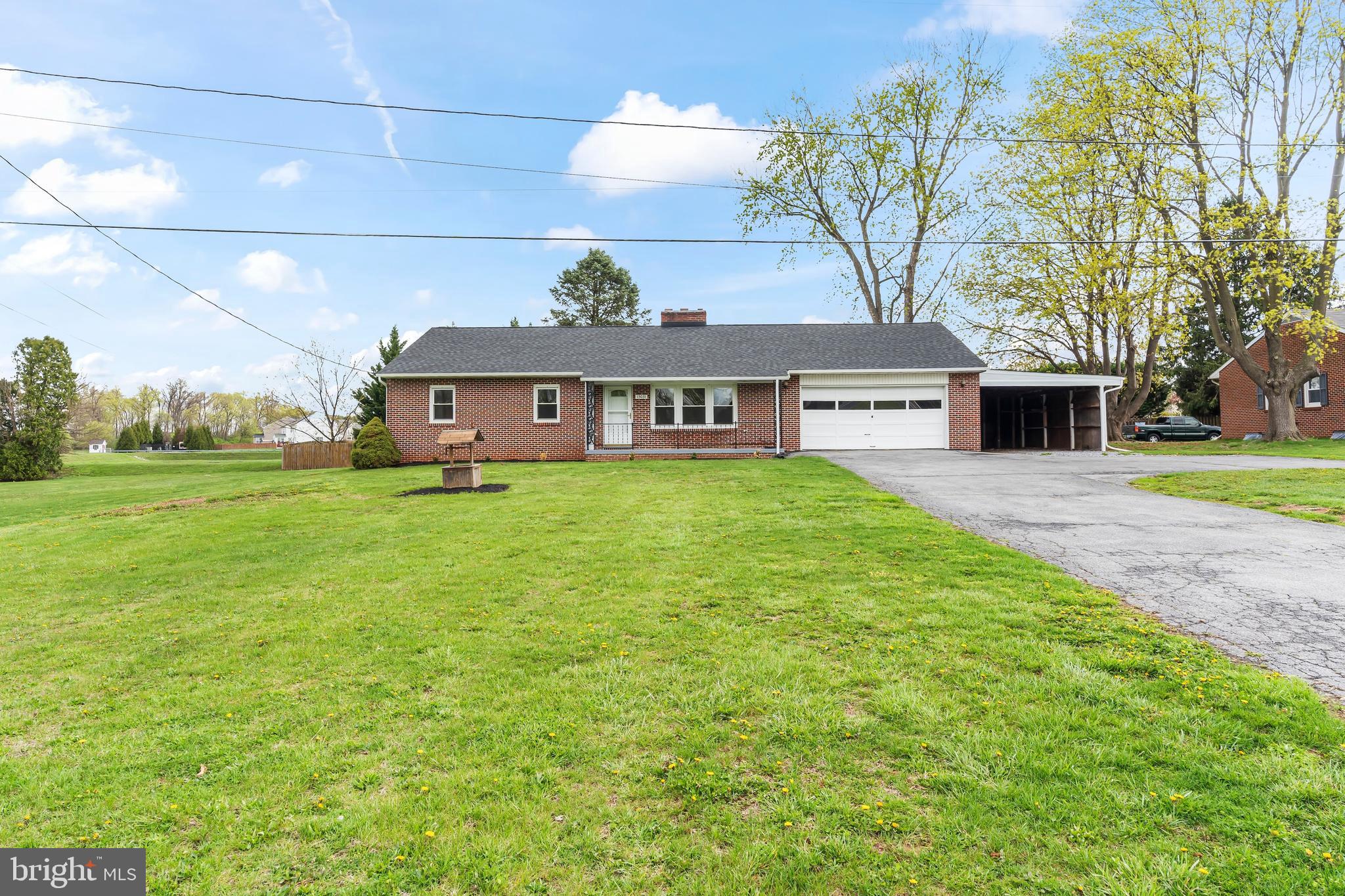 Nicely updated all-brick rancher in a great location.  The home features hardwood flooring, new kitchen cabinets with granite countertops and stainless-steel appliances, fully finished basement, 2 car attached garage and carport.  The main floor has 3 bedrooms, 1.5 bathrooms, large family room with fireplace, new kitchen with eat-in area, laundry room/mud room, and 3 season room.  The lower level has a huge finished family room with fireplace and new flooring.  The entire house has been freshly painted, new electric panel, newer heat pump, new gutters and downspouts.  The roof and windows were installed in 2016 and the septic was installed in 2018.  There is also a backup propane boiler for the cold winter months.  This is a must see!!