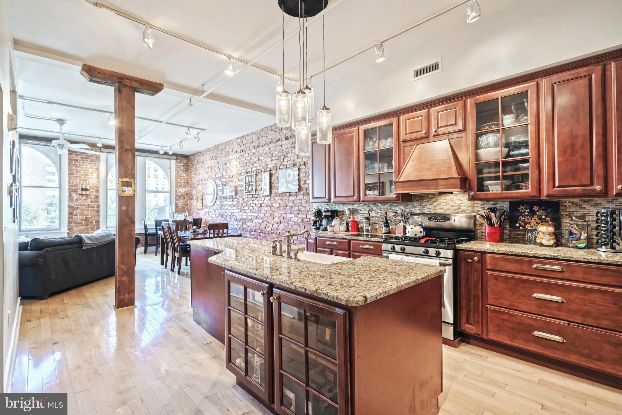 First availability in over three years at York’s downtown premiere condominium building – The LOFTS. With a location second to none, you have the convenience to walk to York’s best downtown restaurants, entertainment, and places of work. This 1 bedroom loft features a kitchen that would rival that of a home in the suburbs –including custom woodwork, oven range, granite counter tops and an oversize island that is perfect for entertaining! With an abundance of natural light, exposed brick, and high ceilings this home truly shows off it’s beautiful characteristics that can’t be found elsewhere. Custom designed walk-thru closet perfect for anyone with a love for fashion. Multiple closets in the Foyer, just in case! Extra large bathroom with dual vanity, in-unit washer/dryer and includes dual entry with double doors to act as a powder room for guest. You can feel at peace in this secluded and secured residence with private covered parking for two, overflow parking for guest and a top of the line security system. With a well-manicured residence-only common area, roof deck, and a separate storage unit included this is the perfect opportunity to achieve that maintenance free and carefree lifestyle you’ve dreamed off.