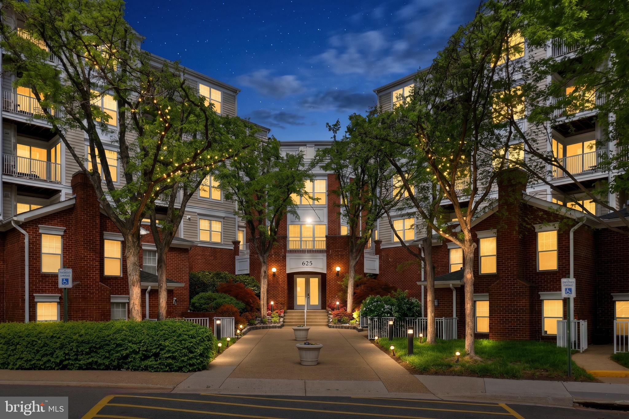 Welcome to Lillian Ct in the heart of McLean. This bright and inviting 3rd-floor corner unit offers 2 bedrooms, 2 baths, plenty of windows, and beautiful natural light throughout. Enjoy cozy evenings by the fireplace or unwind on your private balcony. The spacious primary suite features a walk-in closet, while the second bedroom is generously sized with its own walk-in closet as well. Freshly painted with new carpet and updated bathroom light fixtures, this home is move-in ready. Major updates include HVAC systems replaced in 2024 (estimated) and a water heater replaced in 2022 (estimated). A separate storage unit on the second floor is included—a valuable feature not available with every unit—plus an assigned covered garage parking space. The building welcomes you with a beautiful lobby, elevator, and well-kept hallways. Just across from the clubhouse with fitness room, party room, and outdoor pool. Prime location minutes to Tysons Galleria, Tysons Corner Center, major roads, shopping, and dining. This is one you do not want to miss!