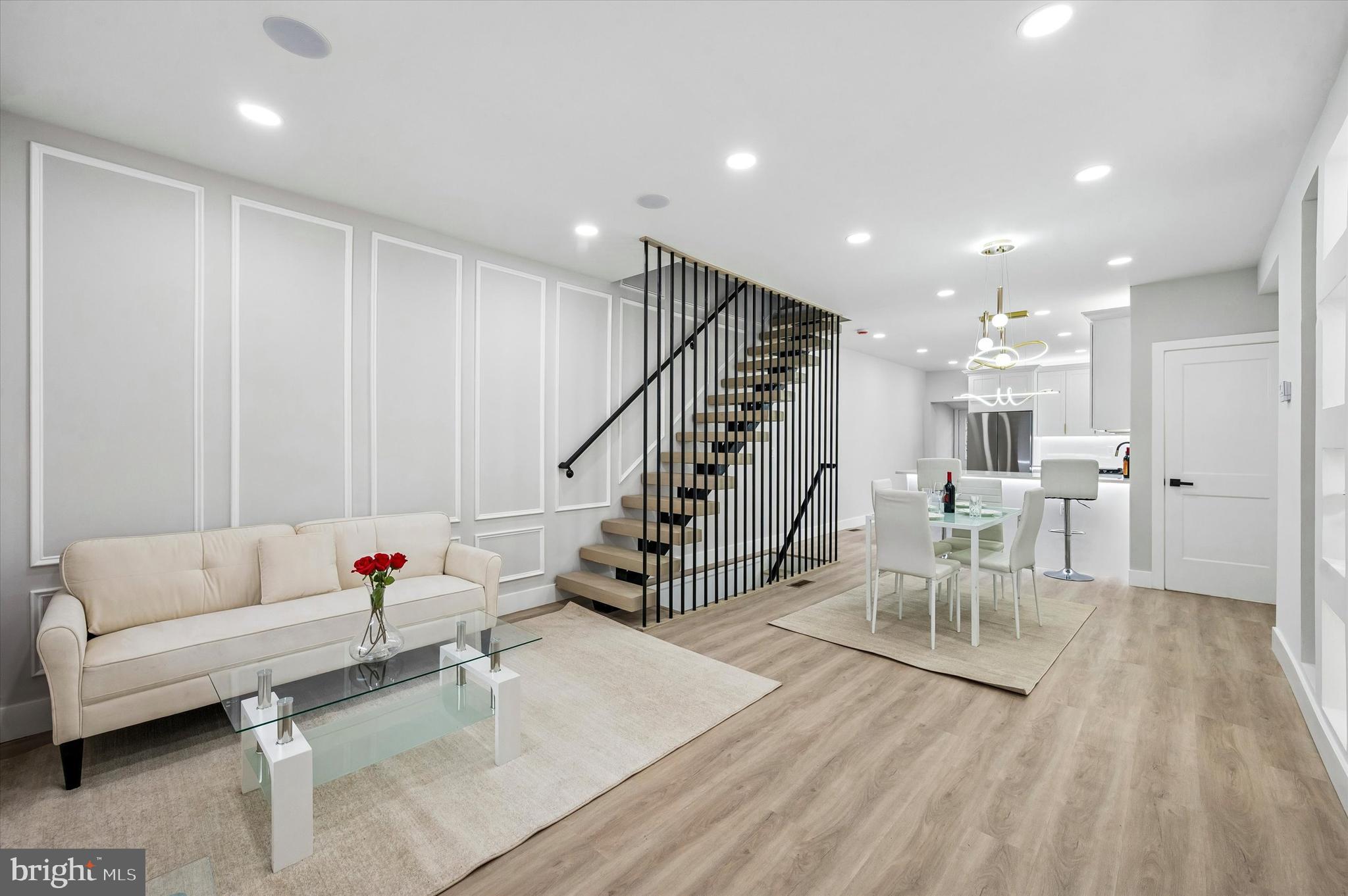 Welcome to 158 N Edgewood Street, a beautifully fully renovated porch front home that blends modern design with comfortable city living.

This stunning 3 bedroom, 1.5 bathroom home offers a bright open concept layout with elegant finishes throughout. The main level features a spacious living and dining area highlighted by custom wall paneling, recessed lighting, and stylish flooring that flows seamlessly into the designer kitchen.

The chef inspired kitchen boasts sleek white cabinetry, quartz countertops, stainless steel appliances, a large peninsula with seating, and modern pendant lighting; perfect for both everyday living and entertaining along with a convenient half bath.

Upstairs you will find two spacious bedrooms filled with natural light along with a beautifully finished full bathroom featuring double vanities, elegant tile work, a soaking tub, and a glass enclosed shower.

The finished lower level offers a third bedroom or flexible space ideal for a guest suite, home office, or gym.

Located in West Philadelphia, this home offers convenient access to University City, public transportation, parks, and local shops.

Move right in and enjoy the perfect combination of modern luxury and city convenience.