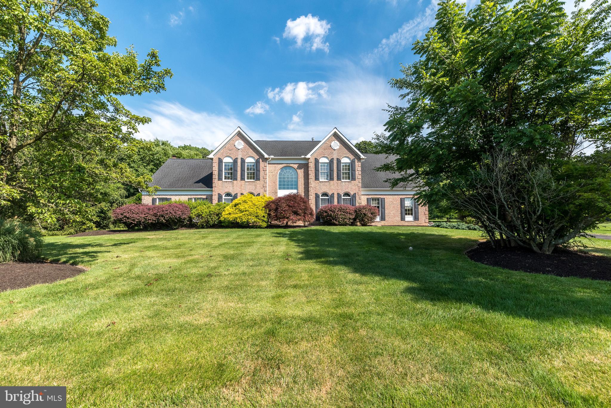 This meticulously maintained 5 bedroom, 3 ½ bath Colonial home is located in the highly sought-after
Buckingham Woods neighborhood. The premium 1.91 acre backs to a tree line, and the heightened
elevation of this lot provides spectacular views from every window. A soaring 2-story foyer welcomes
guests with an elegantly curved staircase. The already spacious floor plan of the Mercer has been
extended and includes an optional guest or in-law bedroom suite on the main level. Wood floors in the
Foyer extend into the Living Room, Dining Room and back to the Kitchen. Stainless steel appliances are
accented by the granite counters and tile backsplash, and the center island provides an overhang for
seating. The Breakfast Area is filled with sunlight through the sliding glass doors that lead outside to a
paver patio. The Kitchen and Breakfast Room are open to the Family Room with cathedral ceiling,
allowing the warmth and cozy atmosphere created by the gas fireplace to be enjoyed from any of these
spaces. A first floor study off the Family Room provides a quiet place for a home office. A Laundry Room is conveniently located on the main level near the powder room and access to the oversized 2 ½ -car garage. Upstairs, the expansive Primary Bedroom Suite with cathedral ceiling includes a huge walk-in
closet and separate Sitting Room. The Primary Bathroom was recently updated with a free-standing
clawfoot tub, double sinks with granite vanities and a tiled stall shower with seamless glass surround.
Three additional bedrooms are generously sized, provide ample closet space and share the full
bathroom accessed in the hallway. Even more living and entertaining space may be found in the finished
basement with recessed lighting, built-in entertainment wall and counter for seating. There is also a
finished bonus room for flexible uses. Nestled within the award-winning Central Bucks School District
with many prestigious private schools in the area. The prime location offers unparalleled convenience
and lifestyle benefits. Just steps away from paved walking/jogging trails and community parks. The
charm of Historic Doylestown is just a short drive away, providing community events, restaurants, and a
host of shops that cater to a variety of tastes and preferences. Easy access to commuter routes and the
train station makes commuting a breeze. Make your appointment today!