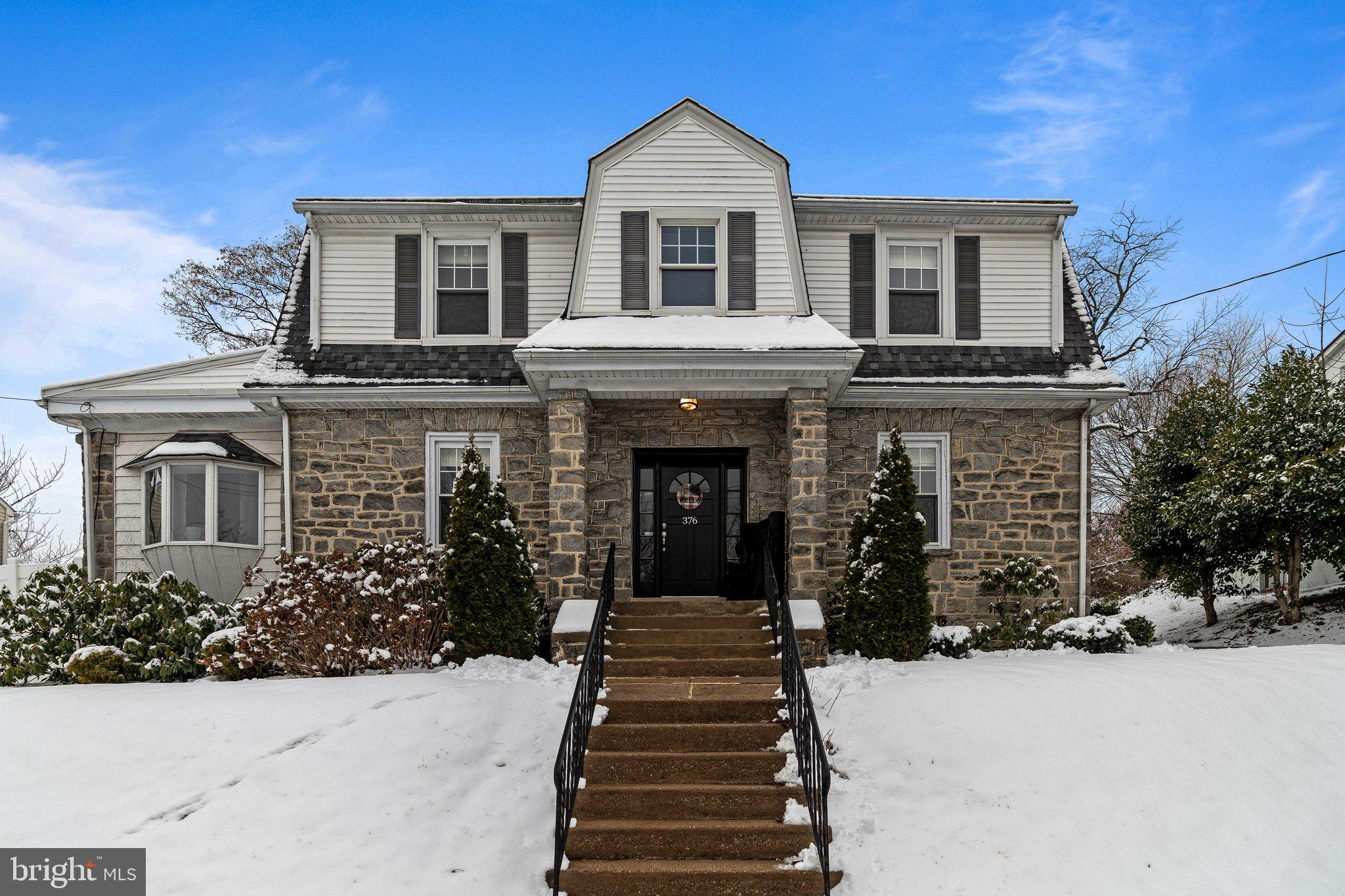 Welcome to 376 Windermere Ave, an exquisitely updated center hall, stone Colonial residence nestled in Upper Darby Township. This handsome home marries modern comforts with timeless elegance, offering an expansive 2,680 square feet of thoughtfully designed living space. Boasting four generously sized bedrooms and two and a half luxurious bathrooms, this property presents a perfect blend of classic charm and contemporary convenience.

Step through the inviting foyer to discover a beautifully functional floorplan adorned with gleaming hardwood floors, featuring a stunning inlay that adds the perfect touch of sophistication. The open kitchen is a culinary enthusiast’s dream, showcasing granite countertops and stainless steel appliances. Whether you’re enjoying casual meals in the eat-in kitchen or hosting in the elegant formal dining room, this space is designed for both comfort and style. A conveniently located powder room on the main living level & freshly painted throughout. The cozy living room boasts abundant natural light and a wood-burning fireplace, creating a warm and welcoming ambiance. Adjacent to the living room, a versatile den offers a convenient space for a playroom, yoga studio, or office etc.

The second floor is expansive with 4 well appointed bedrooms and a hall bath. The primary bedroom is equipped with an ensuite, ample closets and a walk-in closet. The large, unfinished basement, equipped with a new HVAC system installed in 2024, offers ample storage or potential for additional living space. Outside, a charming deck opens to a spacious, fenced-in backyard, perfect for private outdoor enjoyment. The property also features a detached garage and additional private parking spaces, ensuring convenience and ease. This classic home is a true sanctuary in a picturesque setting, with easy access to shopping, public transportation, and more.