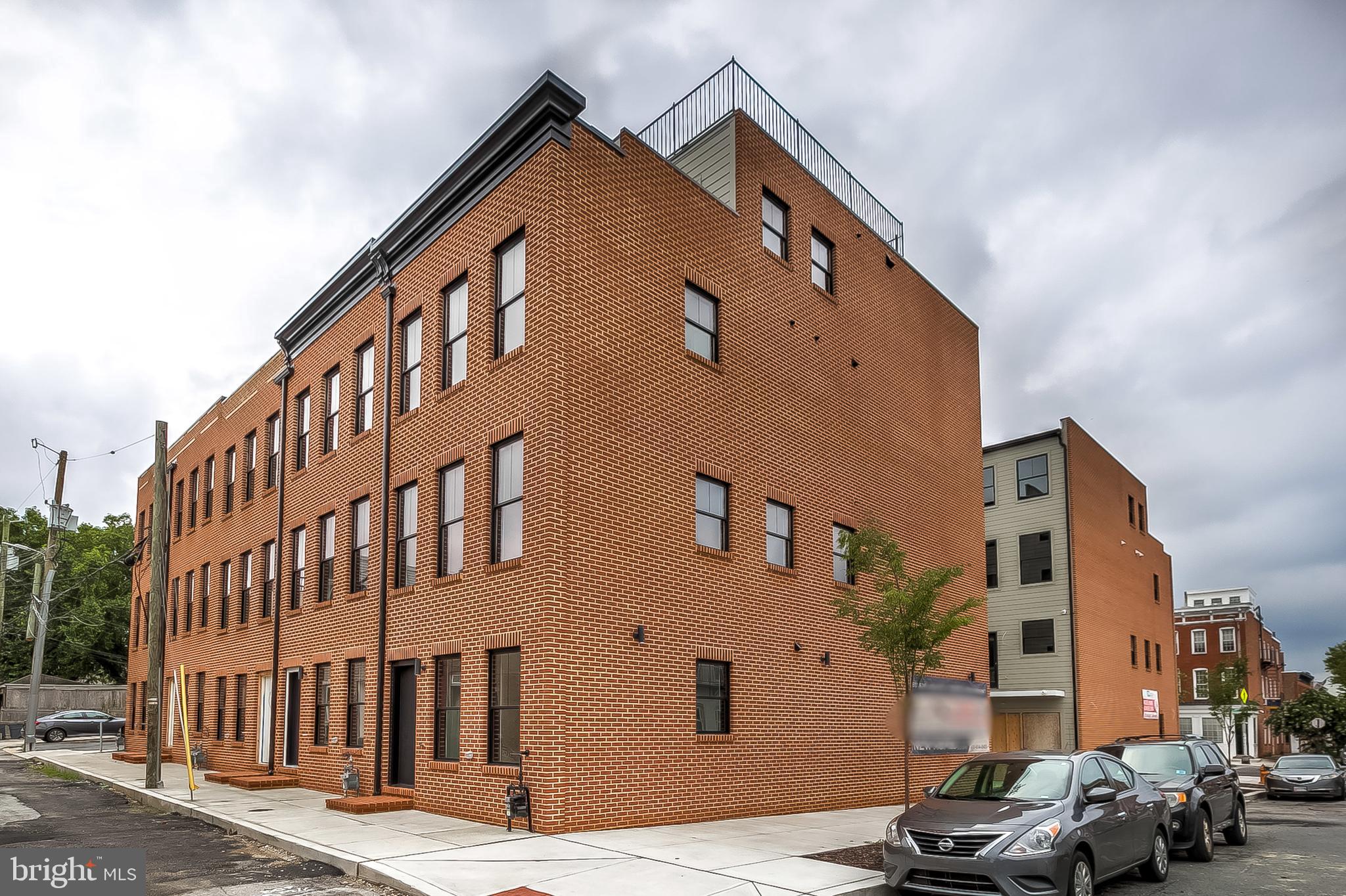 MODEL HOME IS NOW OPEN! NOW SELLING - FEDERAL HILL'S NEWEST 10 UNIT COMMUNITY - HANOVER CROSSING! ONLY 1 OF 2 END UNITS AVAILABLE. THIS OLIVE ST END UNIT IS ABSOLUTELY STUNNING. 16+ FT WIDE BRAND NEW CONSTRUCTION CUSTOM HOMES WITH OVERSIZED GARAGE PARKING LOCATED IN THE HEART OF FEDERAL HILL. GLISTENING FINISHED IN PLACE HARDWOODS CASCADE THROUGHOUT. ENJOY CUSTOM SOFT CLOSE CABINETRY, UPGRADED TRIM AND PAINT PACKAGE, IMPORTED TILE, DESIGNER LIGHTING, GRANITE/QUARTZ COUNTERTOPS, SS APPLIANCES IN DESIGNER CHEF'S KITCHEN WITH GE MONOGRAM APPLIANCE PACKAGE. LOADS OF NATURAL LIGHT. 4 FINISHED LEVELS. 2,700+ SQ FT. HIGH CEILINGS. WALK-IN SHOWERS. WALK-IN CLOSETS. 4 OVERSIZED BEDROOMS WITH 4 FULL BATHROOMS. GORGEOUS BATHROOMS INCLUDE FRAMELESS GLASS SHOWERS AND RAINFALL SHOWER HEADS. EXPANSIVE ROOF DECK FOR ENTERTAINING WITH STUNNING VIEWS WITH WETBAR ON 4TH LEVEL. ENJOY SECONDARY OUTDOOR BALCONY OFF KITCHEN. 5 YEAR NEW CONSTRUCTION/HIGH-PERFORMANCE TAX CREDIT AVAILABLE, SUBJECT TO DHCD APPROVAL.  BUYER TO TAX ALL TRANSFER TAXES. CLOSE PROXIMITY TO RETAIL SHOPPING, LOCAL DINING, AND ALL MAJOR HIGHWAYS. SCHEDULE A PRIVATE TOUR TODAY!