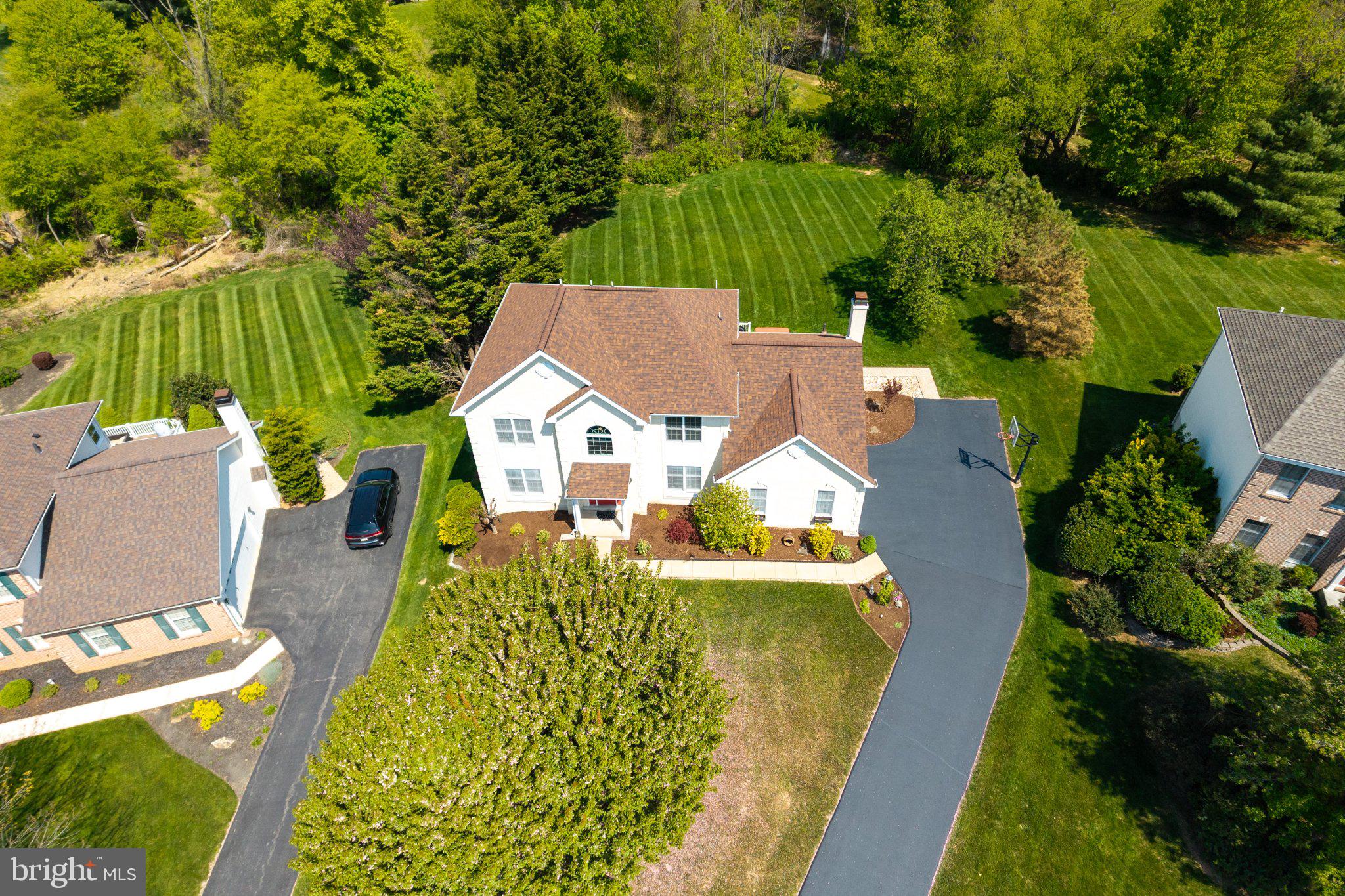 Welcome home to 1345 Wooded Knolls, a beautifully maintained colonial in the highly sought-after Knolls of Birmingham community in West Chester, PA. From the freshly seal-coated driveway to the manicured landscaping and classic colonial facade, this home delivers serious curb appeal before you even step through the front door.
Inside, a hardwood-floored foyer welcomes you with a gracious staircase that sets an impressive tone. A private office to the right offers the perfect work-from-home setup, while the spacious living room to the left flows effortlessly into the formal dining room, ideal for entertaining.
The updated eat-in kitchen is the true heart of this home, featuring granite countertops, a center island, ceramic tile flooring, under cabinet lighting, and a bright breakfast area that flows seamlessly into the main living spaces. Step through the slider off the breakfast area to an oversized deck and stamped concrete patio, perfect for summer cookouts or peaceful mornings outdoors.
Just off the kitchen, the sunken family room impresses with a stunning brick gas fireplace and abundant natural light pouring in through oversized windows and a classic bay window. A conveniently located laundry room and powder room complete the main level.
Upstairs, the primary suite offers a true retreat with a generous walk in closet and an updated private bath. Three additional spacious bedrooms and a hall bath with dual vanity provide plenty of room for family and guests.
The finished basement adds exceptional flex space, perfect for a rec room, home gym, or media room, plus a full bath, dedicated storage room, and an egress window opening the door to future possibilities.
Additional highlights include a 2 car garage, REME HALO whole home air purifier, and an attic blanket for added energy efficiency. Enjoy community amenities like pickleball courts, all just minutes from vibrant West Chester Borough and Kennett Square Borough with easy access to Route 202 and major commuter routes.
