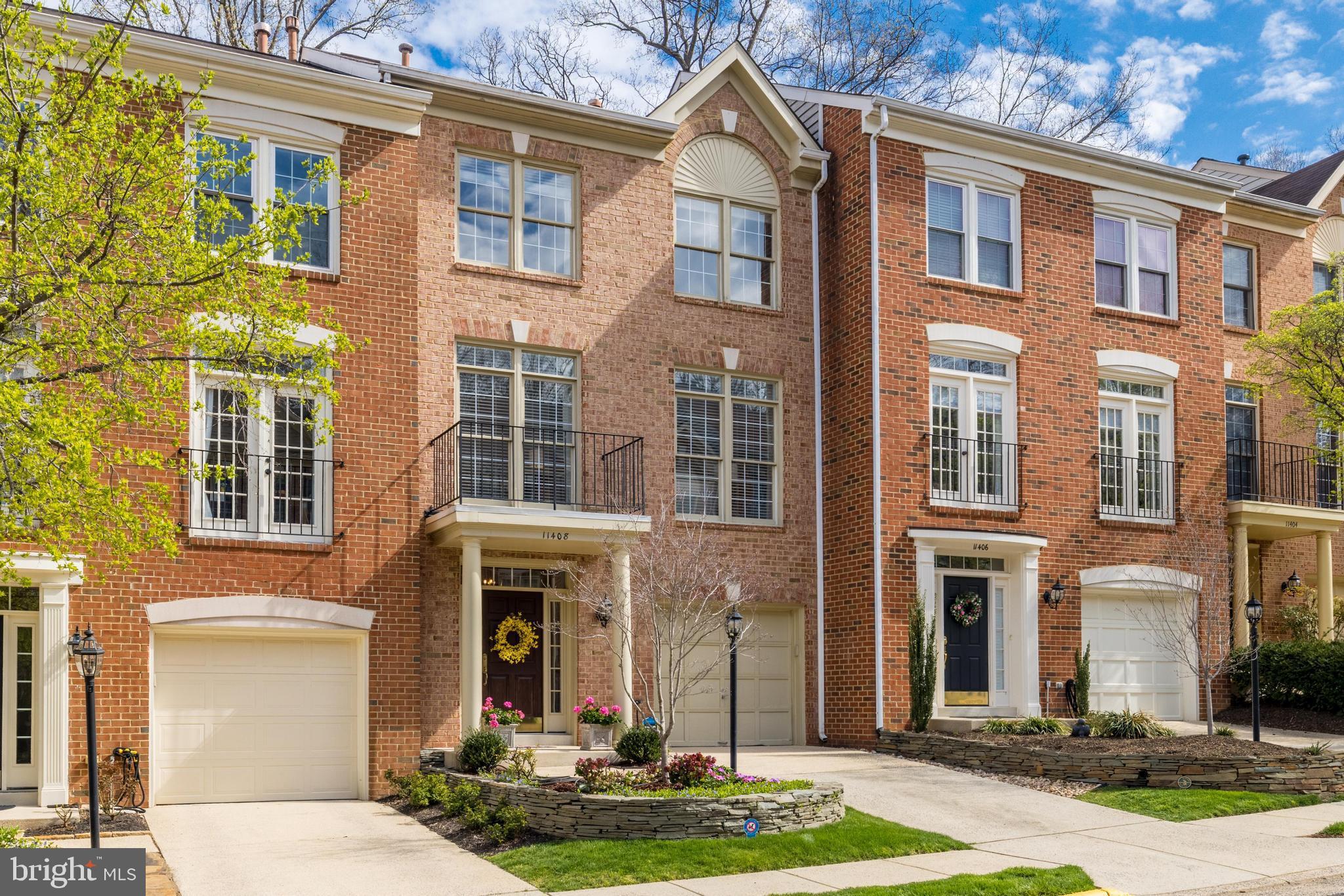 Presenting 11408 Summer House Court, an exceptional residence offering approximately 2,215 square feet of luxurious and natural light-filled living space on all three levels in highly sought-after North Reston neighborhood of Baldwin Grove!
Fully updated on all three levels with designer features, beautiful selections, high ceilings, and wood flooring throughout! 
Enjoy this beautifully renovated kitchen with white wood cabinetry, quartz countertops, tiled backsplash, Thermador stove, range hood, Thermador dishwasher, stainless steel refrigerator, undercabinet lighting, and expansive pantry space. This space opens to the breakfast room with a double-sided fireplace and glass doors to the rear expanded deck that backs to trees, offering exceptional privacy and serenity. 

The family room is bright, and light filled with floor to ceiling windows with stairs leading to the upper level. The primary suite features a vaulted ceiling, walk in closet with custom built-ins, and a bathroom with quartz countertops, soaking tub, glass door shower, and a skylight for exceptional lighting. There are two secondary bedrooms on the upper level, along with a hall bathroom that also features quartz countertops, a glass tub door, ceramic floors, and updated lighting. The stackable washer and dryer units complete this floor of the home.
On the lower level, the recreation room features soaring ceiling heights and ample space for uses. There is also a third full bathroom on this level featuring a shower with glass doors, ceramic tiles, and lovely finishes. Walk out of the recreation room to the fully fenced rear yard with a gate that opens to the common spaces and trails. 
This prime location offers convenient access to parks, trails, pools, and other Reston amenities, and is also minutes to the Reston Town Center, as well as the metro and highways to DC and Dulles Airport.