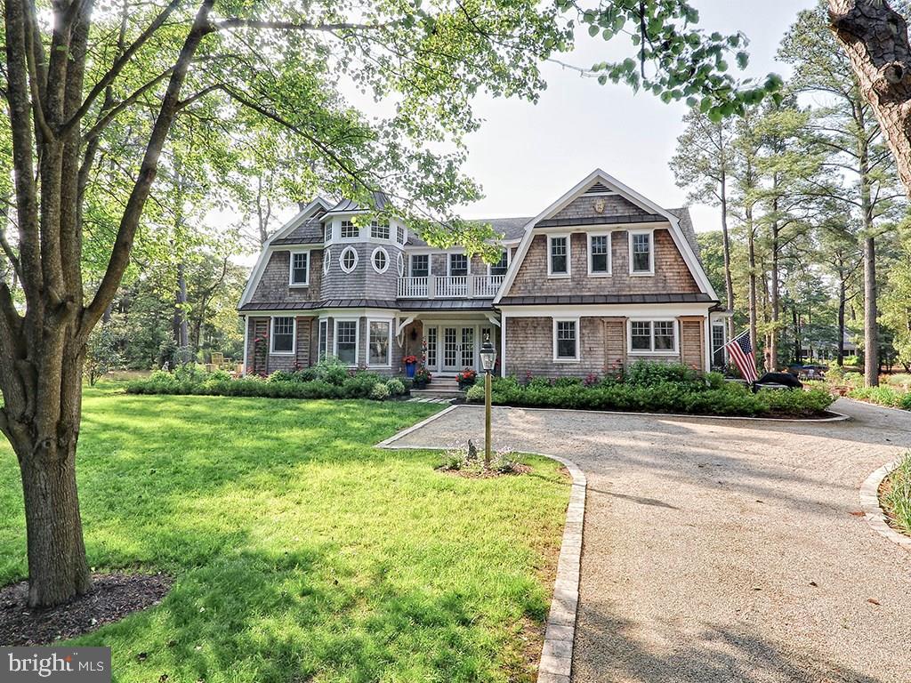 Waterfront & Ocean Block in Henlopen Acres! Gorgeous Shingle Style Home with Elegant Finishes Throughout. Offering Beautiful Sunsets & Stunning Views from Multiple Spaces, Including a Fantastic Private Rear Porch, Perfect for Entertaining or Relaxing. Beautiful Foyer, Formal Dining Room, Study, Living Room with Wood-Burning Fireplace, Master Suite with Sitting Room Overlooking the Lewes Rehoboth Canal. Ideal Backyard for Pool and Waterfront Terrace Leading to the Bulkhead and 40 Foot Dock. Must See!