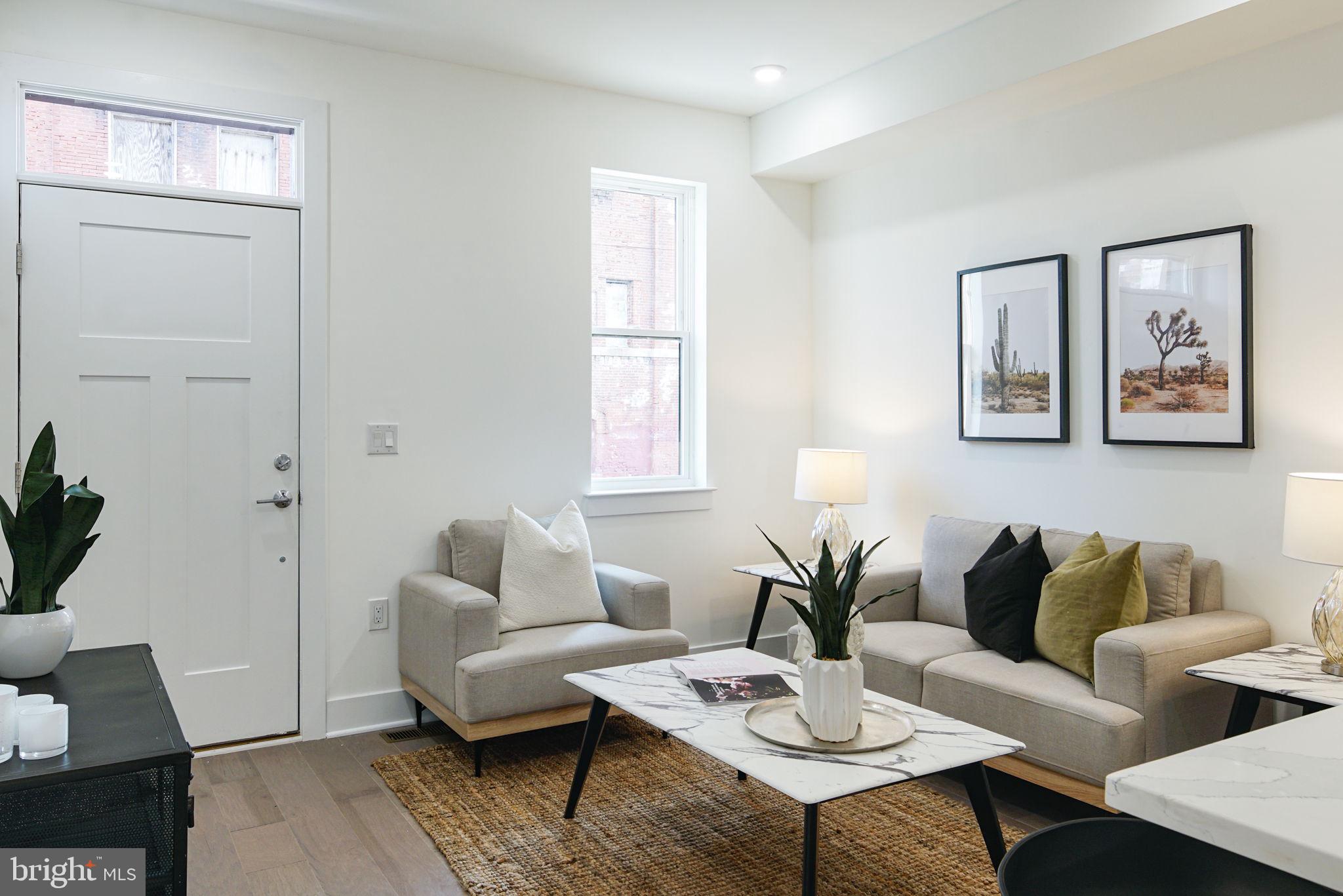 Step into modern luxury with this two-story condominium that perfectly balances style, comfort, and convenience. Offering 3 spacious bedrooms and 3 full bathrooms, this thoughtfully designed home is located just steps from the lively Cecil B. Moore Ave and a leisurely walk to the trendy restaurants, shops, and amenities near N Front St.

As you enter Unit A, you'll be welcomed by a bright and open-concept living space, perfect for entertaining or relaxing. The kitchen is a true showstopper, featuring a sleek wrap-around design with stunning quartz countertops, stainless steel appliances, and a chic marble backsplash that ties it all together. 

The two levels of this condo are designed for ultimate privacy and functionality, with bedrooms on each floor—each paired with its own en-suite bathroom. The layout ensures comfort for everyone, whether it's family, guests, or even roommates. Plus, a dedicated laundry room adds a touch of everyday convenience. 

Don't miss the opportunity to make this stylish and ideally located home yours.