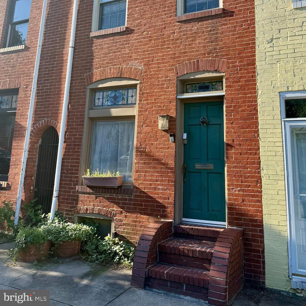 Step into a charming piece of history with this beautifully preserved Federal-style townhouse in the heart of Canton. This inviting home seamlessly blends classic architecture with modern comforts, offering a unique opportunity to create lasting memories. From the cozy living room, and gourmet kitchen, to the 3 spacious bedrooms and 1.5 bathrooms, this residence is designed for both relaxation and entertaining. The generous layout provides ample room for gatherings, while the unfinished basement offers endless possibilities for customization. Natural light pours through the windows, illuminating the rich brick façade and enhancing the warm ambiance throughout. The outdoor spaces, are perfect for enjoying morning coffee or unwinding after a long day. Located in a vibrant neighborhood, you'll find yourself just moments away from local shops, restaurants, and parks, making it easy to embrace the lively community spirit. On-street parking ensures convenience for you and your guests. This home is not just a place to live; it's a canvas for your dreams. Whether you're looking to invest in a piece of history or seeking a cozy retreat, this townhouse offers the perfect blend of charm and potential. Don't miss your chance to make this delightful property your own!