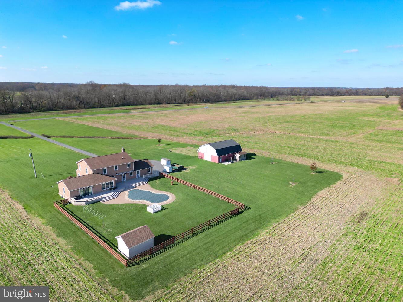 Come take a tour of a beautiful home sitting on 3.8 country acres in Queen Anne's Co. You'll find everything you need to call this place HOME! Includes a  LARGE BARN to house animals, equipment plus storage,  INGROUND POOL w/fenced outdoor entertaining space ready summer & for now,  a GAS FIREPLACE to cozy up to and  decorate for the holidays. From the FRONT PORCH to the GOURMET  KITCHEN to the FOUR SPACIOUS BEDROOMS, 2 w/ private baths = EXQUISITE COUNTRY LIVING.
Totally renovated from top to bottom with quality and efficiency top of mind. Primary bedroom on main level with large walk in closet and bath could possibly be the perfect in law suite with it's own ramp access and steps away from the kitchen making cohabitation effortless. 
The main level includes a gourmet kitchen with granite countertops, stainless appliance, island, bar seating, large dining area and room to prepare meals for all those large parties and holidays. off the kitchen, there's a formal living  room with two sets of  French doors . Not looking for formal living room? No worries, this room would make the perfect office with it close location to the front foyer.  You'll find the family room on the opposite side of the foyer with it's large stone fireplace  that gives you a warm lodge welcome. Many of your cool weather days /nights will be spent watching the fire and relaxing here. 
Circle back around to the kitchen where you are led past the half bath and door leading to the back deck and pool area or to head to the attached garage though the utility/laundry room. 
The second floor offers three additional bedrooms. All rooms are very spacious. Two guest bedrooms will share the hall bath while the other has it's own private bathroom. You will find pull down stairs in the hall for ease of access to the attic space and possible storage.  
Outdoors the front porch will be the spot to watch the sunset and enjoy the evening breeze during the warmer days. Staying cool will not be an issue on those hot summer days when you have your own backyard paradise complete with an inground pool, and entertain deck for those summer BBQs and celebrations. The pool area is completely fenced and includes a shed to store all the pool accessories.
Your inner farmer will be pleased to find a large barn perfect for all your farming equipment. Two heated workshops/ tack rooms. Bring the chickens, ducks, horses, goats....there's lots of room to house them all down on your farmette.