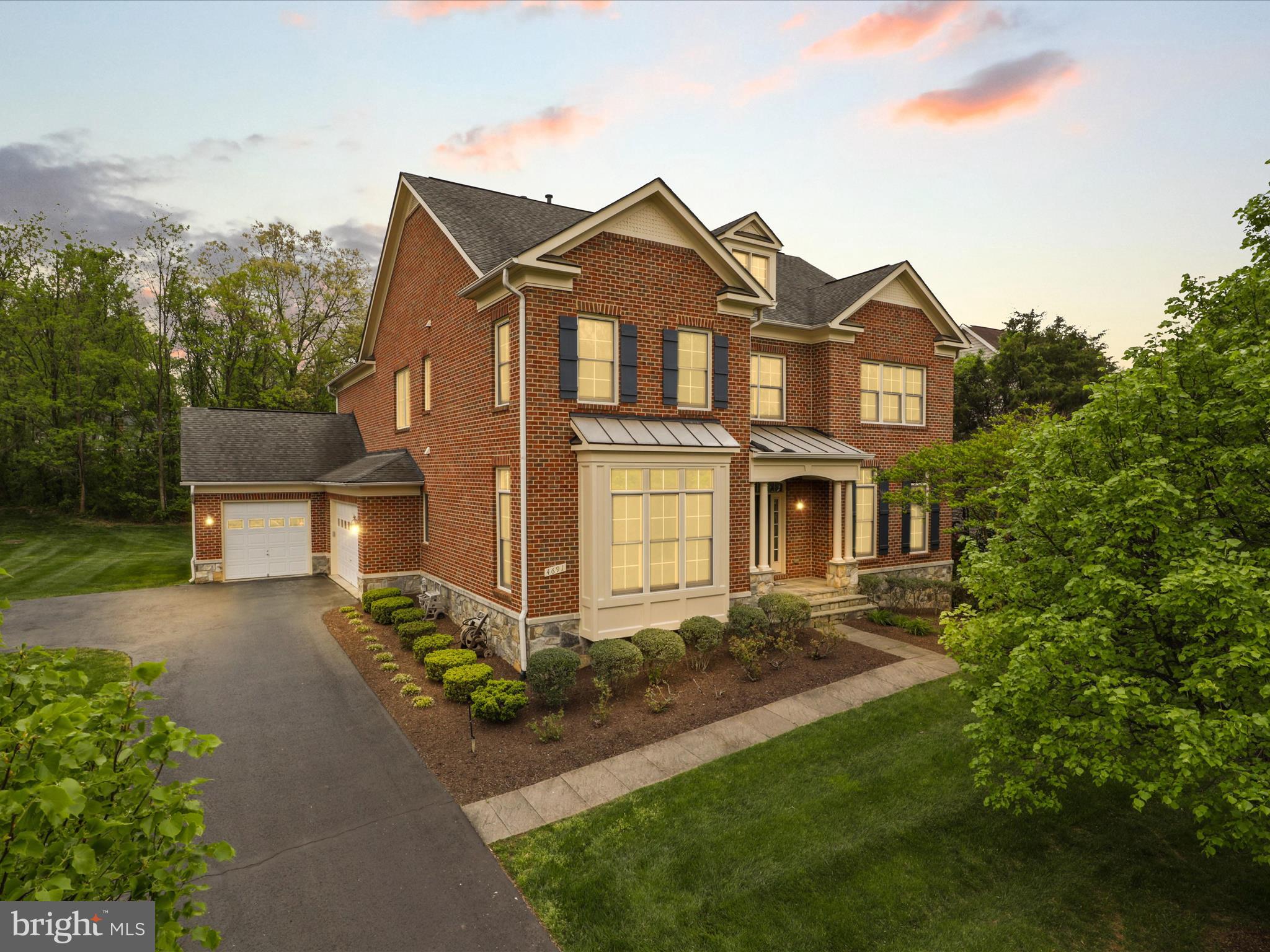 Welcome to this stunning luxury residence in the highly sought-after community of Poplar Parc! This unique WCI Renaissance Grand Cezanne home features a four-sided brick exterior, a spacious 3-car garage, 5 bedrooms, 6 full and 2 half baths and over 7,000 Sq. Ft. of living space. This elegant home offers a graceful lifestyle, with plenty of living space and sophisticated finishing touches.
Special features include: a two story foyer and curved staircase with elegant wrought iron railing. Hardwood floors on the main level & upstairs hallway. Crown molding and recessed lighting throughout. Spacious formal living and dining rooms, with a main floor office that could double as a bedroom. 10’ ceilings on the main level. Expansive family room with a custom coffered ceiling, custom built-in entertainment center and fireplace. The morning room located beside the kitchen offers a bright and airy space for casual dining and leads out to the screened in porch and a Trex deck with TV a/v outputs that is perfect for outdoor entertainment.  Enjoy the tranquility of a spacious backyard, backed by lush trees ensuring your privacy.
The custom Signature kitchen is a chef's paradise, boasting 42-inch raised-panel Cherry cabinets, an oversized island with a sink, granite countertops, backsplash, stainless steel appliances, under counter beverage cooler, wall double oven and a 36-inch 6 burner professional-grade stainless steel cooktop with exhaust hood, and a butler's pantry.
On the upper level, a large owners suite features a double door entry, a separate sitting/exercise area, a tray ceiling, his and hers walk-in closets with custom organizers, an owner's bath with dual vanities, granite countertops, a separate tub, and shower with vertical spa and built-in shelves. Recess lighting throughout.
Three additional oversized bedrooms with their own bathrooms and walk-in closets, as well as the laundry room, are on the upper level.
The fully finished walk-up basement offers a secluded media home theater room with projection equipment and recliners, large rec-room, exercise room, full bathroom, and additional bedroom with its own full bathroom and a walk-in closet. In addition, there is a large unfinished area that offers plenty of room for storage, keeping the space organized and clutter-free.
This upscale community is conveniently located just off U.S. 50, near Interstate 66, Rte. 28 and the Fairfax County Parkway, minutes from The Field at Commonwealth & Fair Lakes shopping centers, Fair Oaks Mall, Fairfax Corner & Fair Oaks Hospital. Dulles International Airport and George Mason University are within a 15 minute drive. Nearby the Ellanor C. Lawrence Park, which offers hiking, fishing, picnicking spots, athletic fields and an amphitheater.