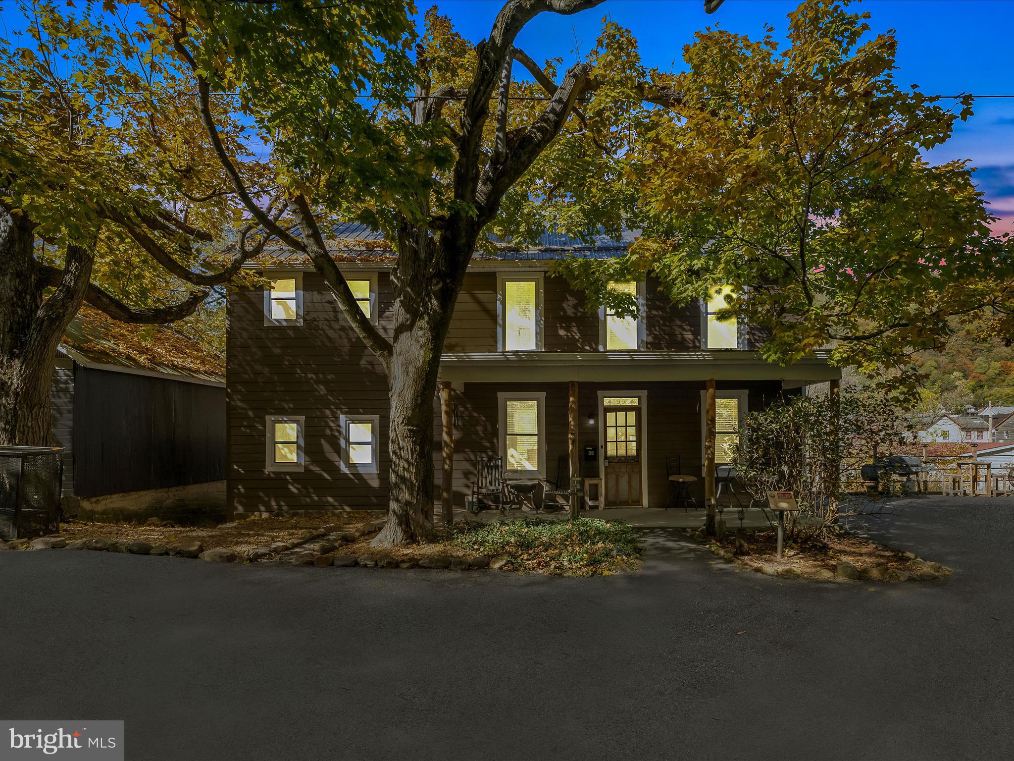 Welcome to the Historic William Smith House in the Town of Bath.  A great location within walking distance to all of the shops, restaurants, and the state park.  A great place with a balcony, rear deck, front covered porch and two lots that border Warm Springs Run, which flows all year.  The driveway has been paved and offers a very nice area to grill and host get togethers.  Inside features a very nice modern kitchen with stainless steel appliances and laundry on the main level.  There is a bedroom and bathroom on the main level with the rest being upstairs.  Lots of natural light and a warm and cozy feeling are what makes this home a stand out!