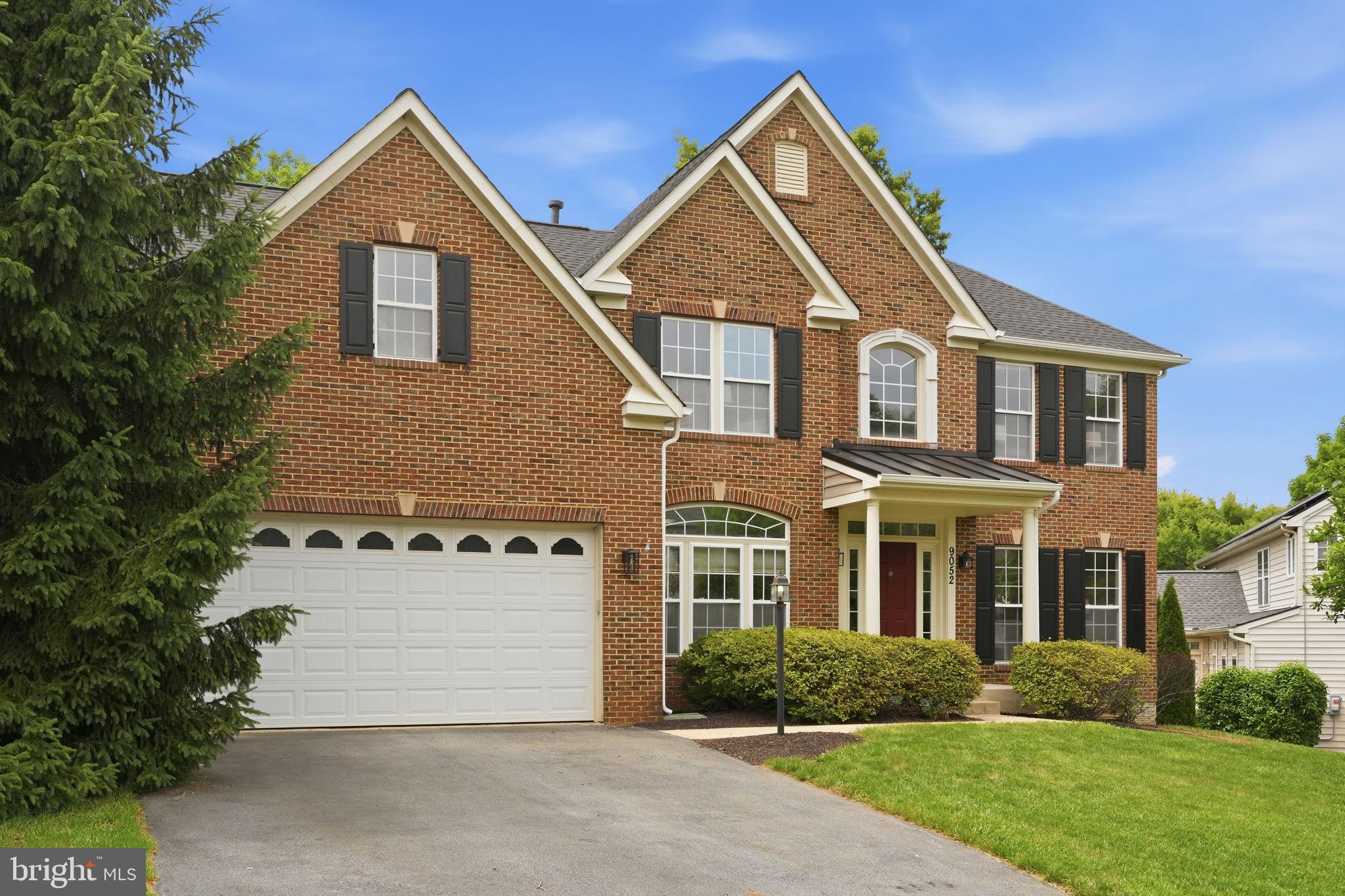 Welcome to 9052 Major Smith Ln, a stunning brick front colonial in the highly sought-after Villages of Urbana. Featuring over 5,600 finished square feet, this home offers light-filled, well proportioned rooms throughout. As you enter the two story foyer, you will notice a large office to your left and bright living room to your right. Off the living room is a formal dining room with chandelier that leads into the spacious kitchen. The kitchen features an oversized island, stainless steel appliances including a double oven, breakfast bar and an attached sunroom. Directly off the kitchen is a massive family room with a gas fireplace as its centerpiece and a vaulted 2 story ceiling. Take either the stairway from the foyer or family room to the upper level featuring a stunning primary suite with a sitting area, walk-in closets and a bathroom with dual vanity, soaking tub and walk-in shower. Three more well proportioned bedrooms and a hall bathroom round out the upper level. The basement is an entertainers dream with the incredible wood bar as its focal point. The wet bar features a kegerator, liquor rack, overhead stemware rack, and seating for 10+. The rest of the basement is an open layout offering the ability to personalize the area however it fits your needs best. The house has been beautifully updated with new hardwood floors in the dining and living rooms and foyer, new carpet upstairs, fresh paint throughout, a new roof and skylights (2024) and hot water heater (2022). As part of Villages of Urbana, you are able to access the community pool, walking paths, playgrounds, tons of shopping, restaurants and local amenities, all while being minutes from I270 making this an ideal home for commuting. Hurry, this house won't last long!