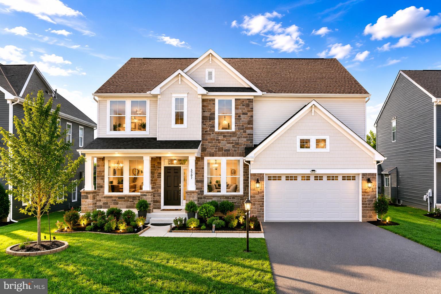 Welcome to 5707 Hawk Ridge Road, an exceptional NorthWest facing Drees Buchanan model nestled in the highly sought-after Tallyn Ridge community of Frederick and zoned to the award-winning Oakdale Elementary, Middle, and High School district. From the moment you arrive, the striking stone façade, charming covered front porch, shaker-style accents, professional landscaping, elegant exterior lighting, elongated driveway accommodating four vehicles, and spacious two-car garage establish a commanding first impression. Inside, a sun-drenched foyer adorned with crown molding welcomes you into a thoughtfully designed floor plan featuring a private study behind French glass doors and an elegant formal dining room crafted for memorable gatherings. The heart of the home unfolds into a breathtaking sunlit two-story family room with soaring ceilings, walls of windows, abundant natural light, and a modern cosmo gas fireplace accent wall create a dramatic yet inviting atmosphere. Luxury vinyl plank flooring, fresh designer paint, recessed lighting, and a sophisticated neutral palette flow seamlessly throughout the main level. The gourmet chef’s kitchen is a true showpiece, featuring luxury calacatta quartz countertops, 42-inch gray cabinetry, a five-burner gas cooktop, stainless steel vented hood, double wall ovens, built-in microwave, and an oversized center island designed for entertaining. One of the most desirable features of this Buchanan model is the rare expanded morning room addition, filling the home with sunlight while providing substantial additional square footage on both the upper and lower levels, creating the perfect breakfast room, sunroom, or gathering space overlooking the backyard. A highly desirable main-level bedroom and full bathroom provide exceptional flexibility for guests, multigenerational living, or a private office suite, while a functional mudroom completes the main level. Ascend the beautiful staircase to the luxurious primary suite featuring a spacious sitting room extension, designer window treatments, recessed lighting, and a spa-inspired en-suite bath with quartz countertops, dual vanities, an additional extended vanity area, soaking tub, oversized walk-in shower, private water closet, and an expansive walk-in closet. Three additional generously sized bedrooms feature ceiling fans, walk-in closets, and custom window treatments, complemented by a beautifully appointed secondary bath and convenient upper-level laundry room featuring upgraded Samsung dual-load washer and dryer units capable of running two loads simultaneously. The finished lower level offers an expansive recreation room, a rare upgraded six-foot-wide walk-up exit, a full bathroom with walk-in shower, rough-in for a future wet bar, and multiple unfinished spaces ideal for a future gym, theater room, sixth bedroom, or additional finished living space. Built in 2022, this meticulously maintained home showcases an impressive list of upgrades including a two-story family room, gas fireplace, 9-foot ceilings on the main and upper levels, EV charging outlet, solar conduit rough-in, water softener, whole-house water filtration system, dual 100-gallon electric water heaters, premium window treatments, recessed lighting throughout, and a stunning Granite City paver patio designed for outdoor entertaining. Enjoy resort-style amenities including a community clubhouse, fitness center, outdoor swimming pool, playgrounds, walking trails, and scenic open green spaces. Conveniently located minutes from Downtown Frederick, Historic Main Street, Wegmans, Costco, Market Square, Clemson Corner, numerous restaurants and shopping destinations, and offering easy access to I-70, I-270, Route 15, Route 144, and major commuter routes to Washington D.C., Baltimore, Northern Virginia, Fort Detrick, and Montgomery County, this extraordinary residence seamlessly combines luxury, functionality, location, and lifestyle into one remarkable offering.