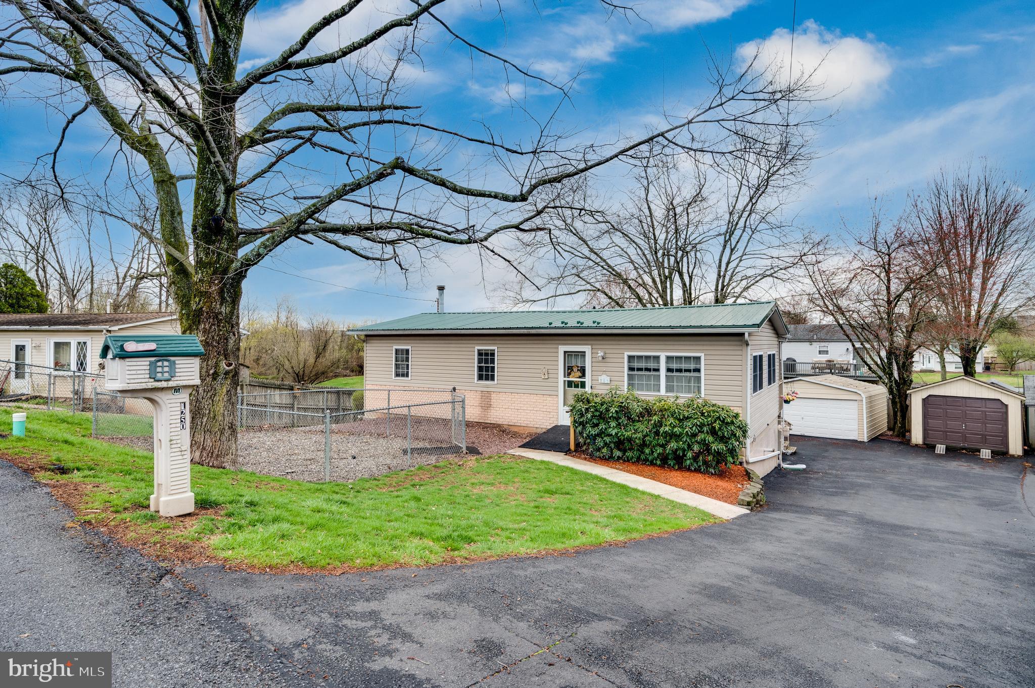This property has a long  driveway with one attached garage, and two detached garages  for storage, or a potential workshop!  The deck offers space for grilling, relaxing, or outdoor activities. Located in Exeter school district. Bring your offers!