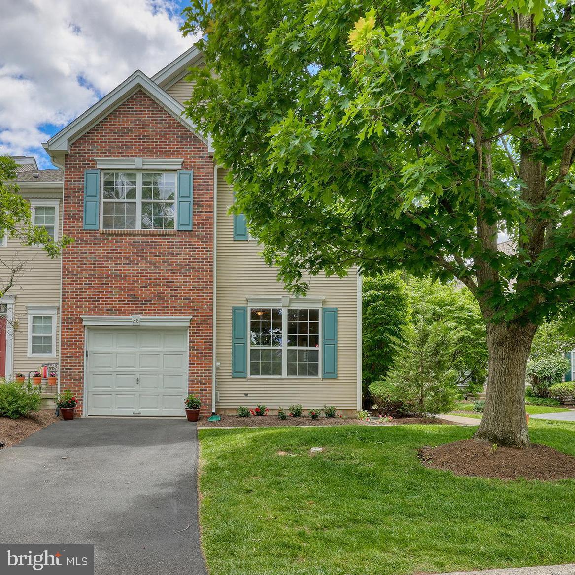 Welcome to 28 Tankard Lane, your invitation to carefree living in beautiful Washington Crossing, the desirable Heritage Hills community and Council Rock School District.  Move right into this turn key 3 bedroom, 2.5 bath end unit townhome on a quiet street featuring a lovely open floor plan, gorgeous natural light, gleaming hardwood floors (1st floor), finished lower level and new deck (top only).  From the moment you walk in the door, 28 Tankard Lane beckons you to sit down and stay awhile. The living room and dining room offer ample room to gather with friends and family to create great memories. Curl up with a great book and cup of coffee in the stunning 2-story great room centered around a wood-burning fireplace - the gorgeous natural light from 6 over-sized windows streams into the nearby kitchen. Enjoy cooking and entertaining? This kitchen will be your happy place with generous counter space, stainless appliances,  and a breakfast bar. An exterior sliding door leads to the southern-facing newly refurbished wood deck with great privacy for seamless indoor/outdoor dining and grilling. The powder room and interior garage access complete the first level. Follow the turned staircase to the 2nd floor where a charming landing overlooks the sunny great room area below. The 2nd level provides a wonderful primary bedroom with vaulted ceiling, two large closets and an ensuite bath with soaking tub, glass shower and dual vanity. Two other carpeted bedrooms share a nicely appointed hall bath with white vanity and tub/shower. A convenient upper level laundry room finishes this floor. Looking for additional living space? Don't miss the finished lower level with bright open family room ideal for game room, playroom, office area or exercise studio and two unfinished storage rooms. Additional recent updates include newer roof (HOA - 2022) and HVAC system (2022).  Heritage Hills residents enjoy terrific community amenities including an in ground pool and tennis courts. Appreciate nearby Washington Crossing State Park, the Delaware Canal tow path, quaint eateries and convenient gourmet store/bakery. This is your moment to start making the most of quintessential Bucks County living at its very best!