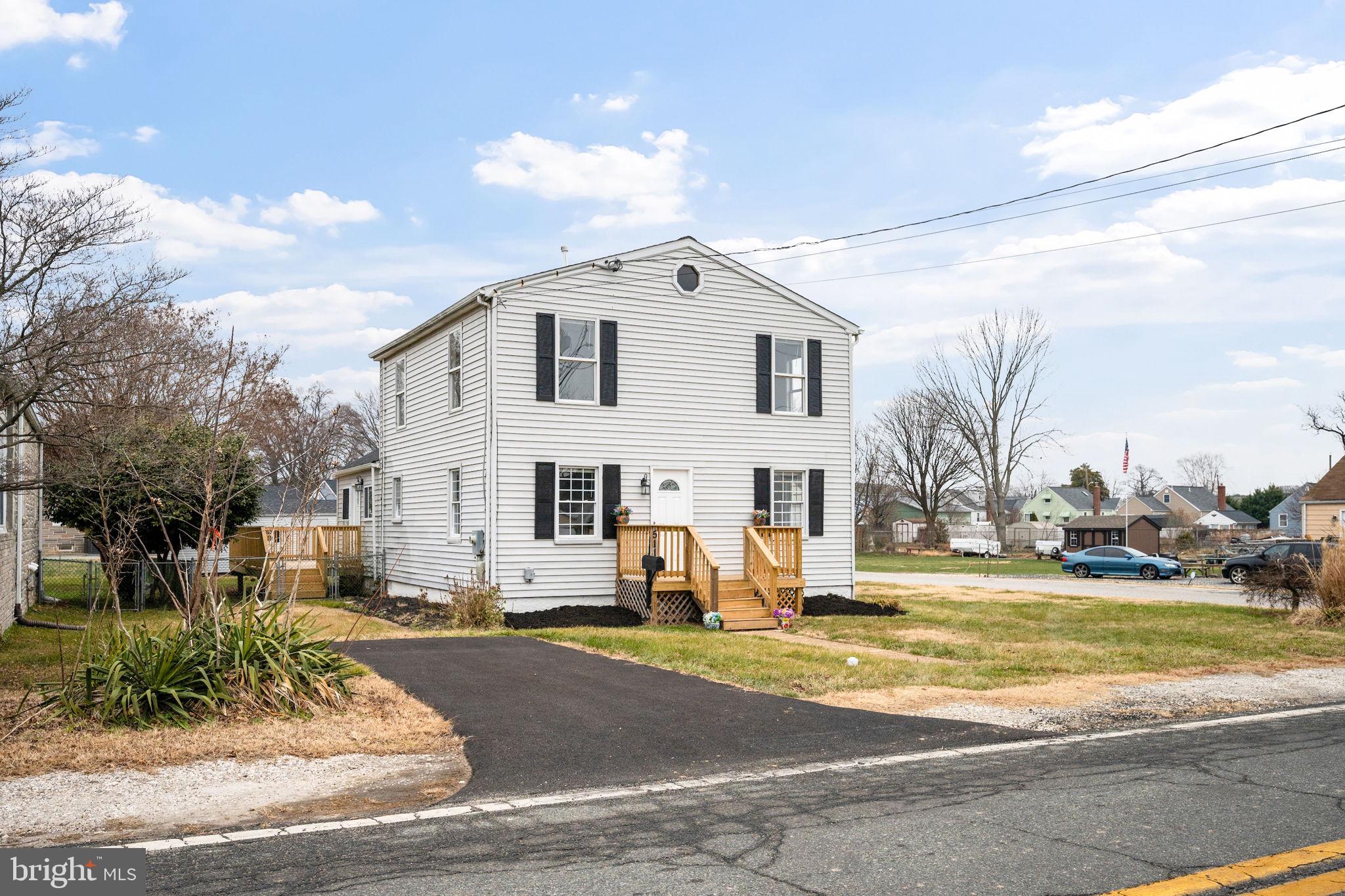 Newly remodeled 5BR/3BA expanded colonial situated on a spacious corner lot in the water oriented community near Cox's Point Park! Pull into the newly paved driveway and step inside a home designed for both comfort and style. The interior is filled with natural light and features blond luxury flooring, new carpeting, a freshly painted soft neutral palette, an open main-level layout, and numerous upgrades throughout.

The main level offers a large living room open to the dining area with sightlines into the stunning, newly remodeled kitchen. The kitchen showcases abundant cabinetry, stainless steel appliances, sleek quartz countertops with a coordinating tile backsplash, and a deep stainless-steel sink positioned beneath a window. Completing the main level is a full bath, a versatile room ideal for a home office or additional bedroom, and a main-level primary bedroom featuring a wall of closets and a private en-suite bath.

The upper level includes two spacious secondary bedrooms, an additional primary-sized bedroom, and a newly remodeled full bath with a walk-in shower. Step outside from the main level onto the newly constructed wrap-around porch overlooking the fenced yard with plenty of green space, plus a detached one-car garage and additional paved parking.

Beyond the home, enjoy the lifestyle the neighborhood near Cox's Point Park offers. Residents enjoy easy access to a public boat ramp, playgrounds, and open green space perfect for weekend cookouts and outdoor gatherings. Back River offers deep water ideal for kayaking, canoeing, and boating, with direct access to the Chesapeake Bay for even more adventures on the water. Entertainment and outdoor enjoyment truly begin just outside your door, with walkable proximity to Weavers Yacht Club and Riverside Marina for fuel and storage. 

All of this, plus convenient access to shopping, dining, and commuter routes. This is a move-in-ready home offering views, lifestyle, and community in one exceptional setting.

Buyers may be eligible to take advantage of available loan programs and grant opportunities designed to offer competitive rates and help minimize out-of-pocket expenses. Buyer eligibility to be confirmed with a preferred lender.