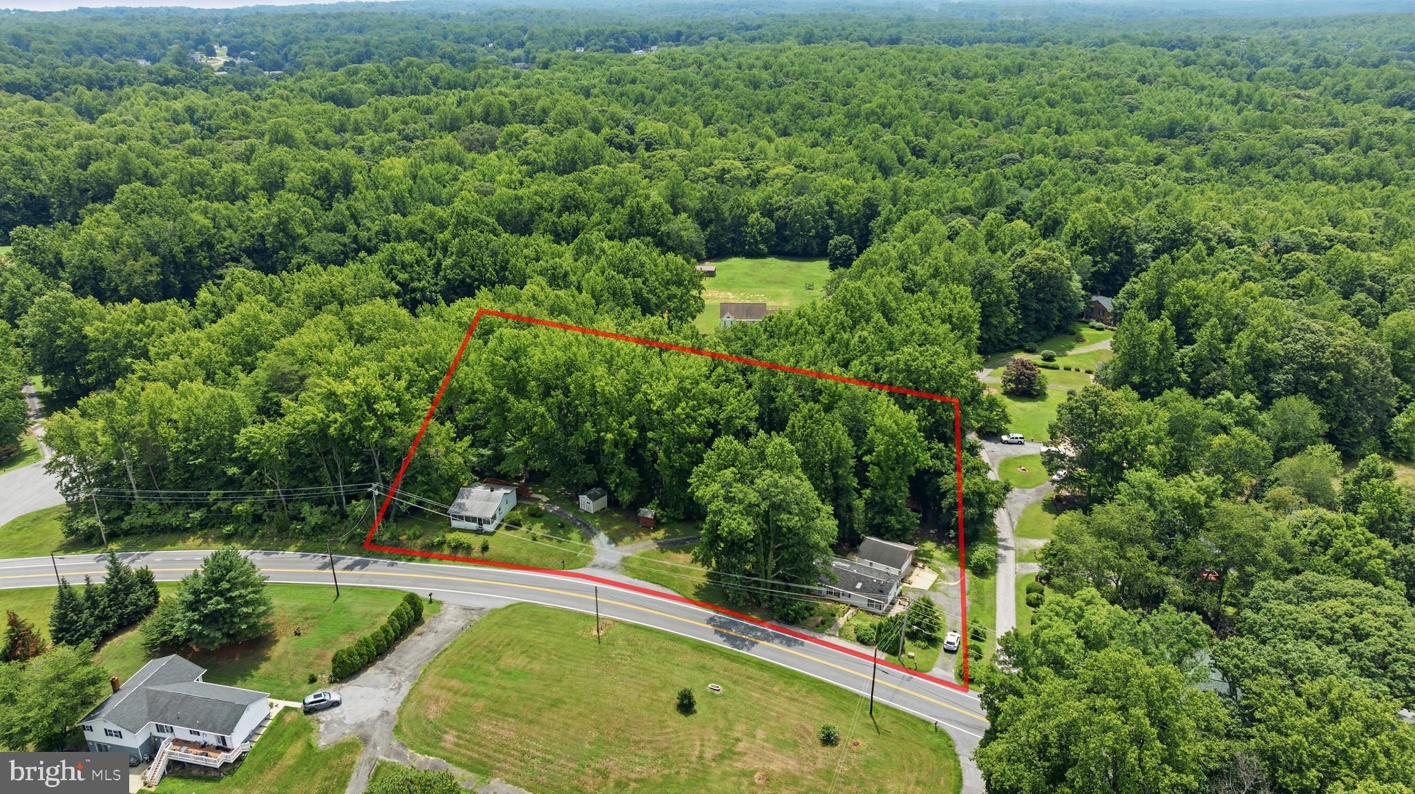 RARE HUNTINGTOWN TWO-UNIT OPPORTUNITY!! Two Units at $150,000 each in this zip code is virtually unheard of. Situated on 1.22 private acres surrounded by mature trees, this versatile property features two separate homes, each with its own private well and septic system, making it ideal for multigenerational living, rental income, guest accommodations, or creating your own family compound.

The primary residence is a spacious 3-bedroom, 2-bath manufactured home with an open-concept layout, generous living and dining areas, a large kitchen filled with natural light, and a private primary suite complete with an oversized ensuite bath featuring dual vanities and a soaking tub. While the home is in need of updating and cosmetic improvements, it offers an outstanding footprint and tremendous potential to create your dream home.

Adding even more value is the detached 1-bedroom, 1-bath cottage, perfect as an in-law suite, guest house, private office, rental opportunity, or space for extended family. The property also features an impressive detached block-built two-car garage, ideal for car enthusiasts, contractors, hobbyists, or anyone needing exceptional workshop and storage space.

Outdoor living is equally inviting with mature landscaping, expansive yard space, multiple storage sheds, and plenty of room for gardening, recreation, or future enhancements. The peaceful country setting offers privacy while remaining just minutes from Huntingtown schools, shopping, restaurants, and an easy commute to Washington D.C., Annapolis, Joint Base Andrews, and PAX River.

Whether you're an investor searching for your next value-add project, a buyer looking for a property with income-producing potential, or someone seeking space for multiple generations under one address, opportunities like this rarely come to market in Huntingtown.

Bring your vision, unlock the potential, and make this exceptional property your own! Properties offering two homes, separate utilities, a detached garage, and acreage in this location don't come along often—schedule your private tour today!