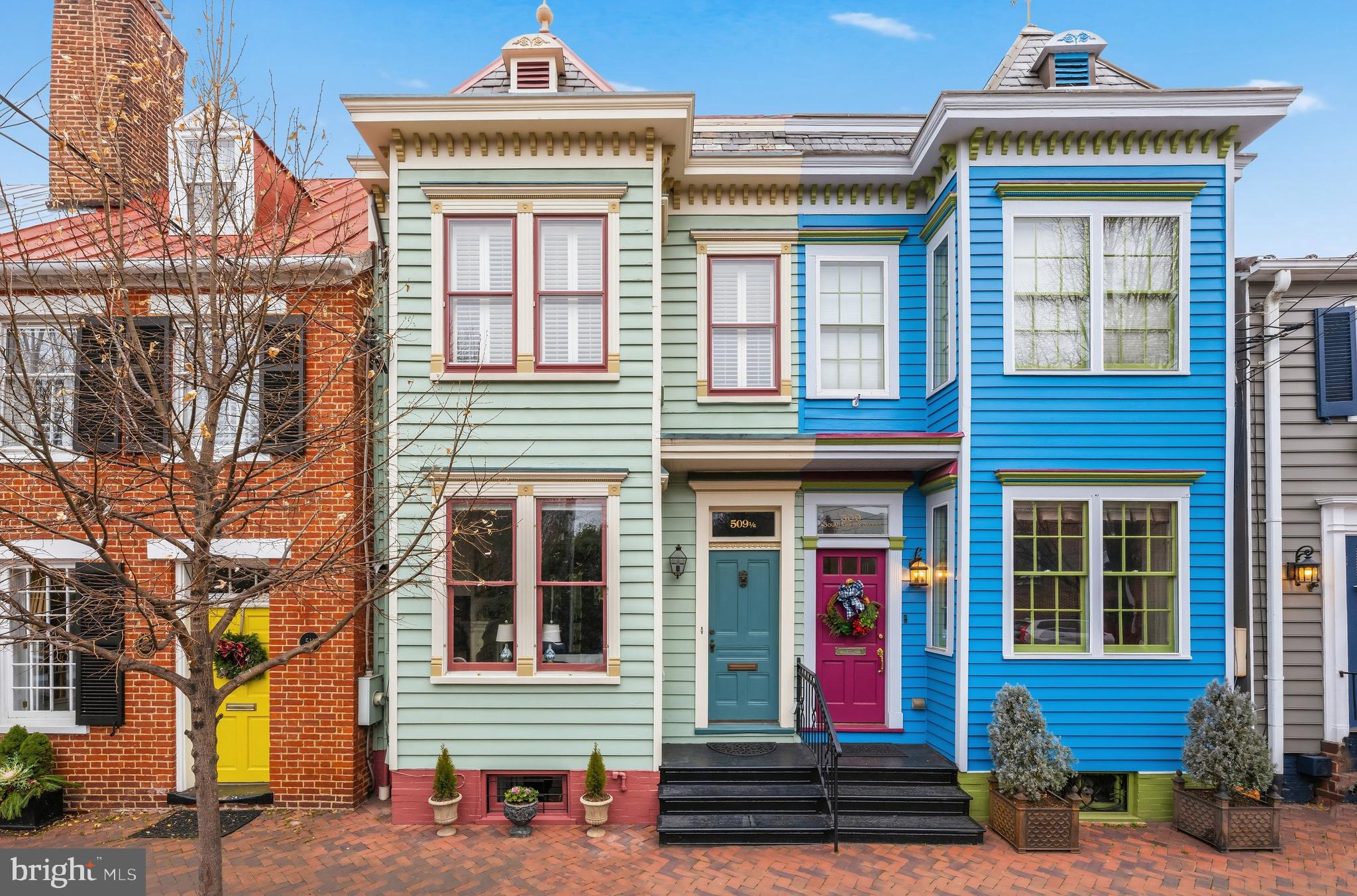 Step inside one of Old Town’s most charming Painted Ladies, a 1900 Victorian that still carries its original soul, but lives perfectly for today. High ceilings, classic millwork, cylinder glass windows, and solid wood doors with exquisitely detailed brass hardware set the tone from the moment you step through the front hall. A graceful hallway links the front parlor to the dining room, complete with a coat closet and picture molding, offering that rare combination of historic character and real functionality.

Toward the back of the home, the layout opens into your everyday spaces: an eat-in area (or den) anchored by a double-sided fireplace, flowing into a family room with tall ceilings and custom built-ins. The kitchen is bright and inviting, featuring a generous amount of storage, including a pantry cabinet, expansive Quartz countertop space, and Sub-Zero fridge. A skylit side hall creates easy circular flow, and the main level powder room is tucked just around the corner.

The showstopper is the screened-in porch with soaring 13' ceilings, detailed woodwork, mahogany flooring, and beadboard ceiling with fan for warm evenings. Step down to a brick patio framed by planters with a back gate leading to the alley, ideal for easy bike access.

Upstairs, natural light pours down the beautiful hallway skylight and into all three bedrooms. The primary suite is generous and practical with two walls of closets (both built-ins and full closets), room for a king bed, and a private deck overlooking the quiet, landscaped garden. The en-suite bath offers dual sinks and a serene feel that matches the rest of the home, plus a clever laundry chute. A built-in desk area with shelving makes remote work easy without sacrificing bedroom space, or turn this room into a dressing area. 

Storage is a standout theme - rare for historic Old Town homes - and continues into the lower level den, including a full wall of hidden storage behind custom cabinet doors, plus laundry, utility sink, and cedar closet (in which the sellers were told plumbing exists if someone wanted to finish a bath). The crawlspace has a vapor barrier and is used confidently for storage. Both fireplaces are known to be working but convey as-is.