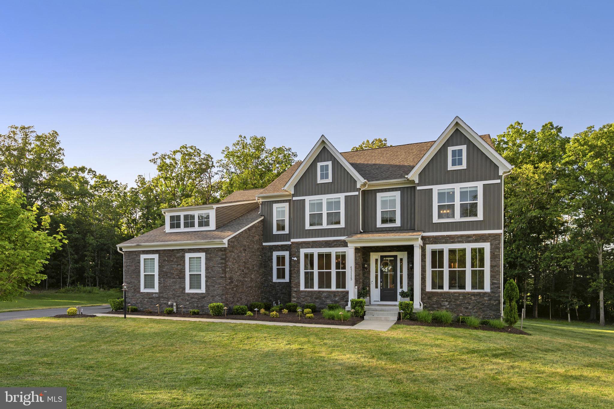 Designed for elevated living and effortless entertaining, this exceptional luxury residence offers 7,566 square feet of thoughtfully designed living space on a 1.21-acre homesite in the prestigious Reserve at Holly Springs. Blending timeless elegance with modern functionality across three levels, the home welcomes you with a grand foyer that opens to sophisticated formal and casual living spaces accented by expansive windows, designer lighting, and refined architectural details throughout. The formal dining room and sitting room provide elegant spaces for gatherings, while the expansive living room with a fireplace serves as a warm and inviting focal point for both entertaining and everyday living. At the rear of the home, the spacious family room offers an additional gathering area and flows seamlessly into the kitchen and breakfast space. <br><br>

At the heart of the home, the chef-inspired gourmet kitchen is a true showpiece, featuring an oversized quartz island, abundant custom cabinetry with illuminated display cabinets, premium stainless steel appliances, a walk-in pantry, and a sun-filled breakfast nook. Thoughtfully designed for both entertaining and daily life, the kitchen seamlessly connects to the surrounding living spaces, creating an ideal setting for gatherings of any size. A private main-level bedroom with a full bath provides exceptional flexibility for guests, multigenerational living, or a dedicated home office. The main level also includes a convenient mudroom and access to the attached garage. <br><br>

The upper level is thoughtfully designed around a spacious loft that serves as an inviting secondary gathering space, ideal for relaxing, entertaining, studying, or working from home. Four generously sized bedrooms are located on this level, each offering access to its own bathroom and dedicated closet space—an exceptional feature that provides comfort and privacy for family members and guests alike. The luxurious primary suite serves as a private retreat, complete with a spa-inspired bath featuring dual vanities, an oversized walk-in shower, soaking tub, and an expansive walk-in closet. <br><br>

The expansive lower level offers incredible flexibility with a large recreation area and abundant storage spaces, providing endless opportunities for future customization, fitness, hobbies, media, or additional living space tailored to your needs. <br><br>

Set amid beautifully landscaped grounds on a private 1.21-acre lot, this remarkable property offers an exceptional sense of space and privacy while remaining conveniently connected to major commuter routes, including Route 50, Route 28, I-66, and the Dulles Corridor. Enjoy close proximity to premier shopping, dining, entertainment, parks, and everyday conveniences in Centreville, Chantilly, South Riding, and Stone Ridge, with Washington Dulles International Airport just a short drive away. Offering a rare combination of scale, luxury, privacy, and thoughtful design, this stunning residence presents an extraordinary opportunity to enjoy refined living in one of Northern Virginia's most sought-after communities.