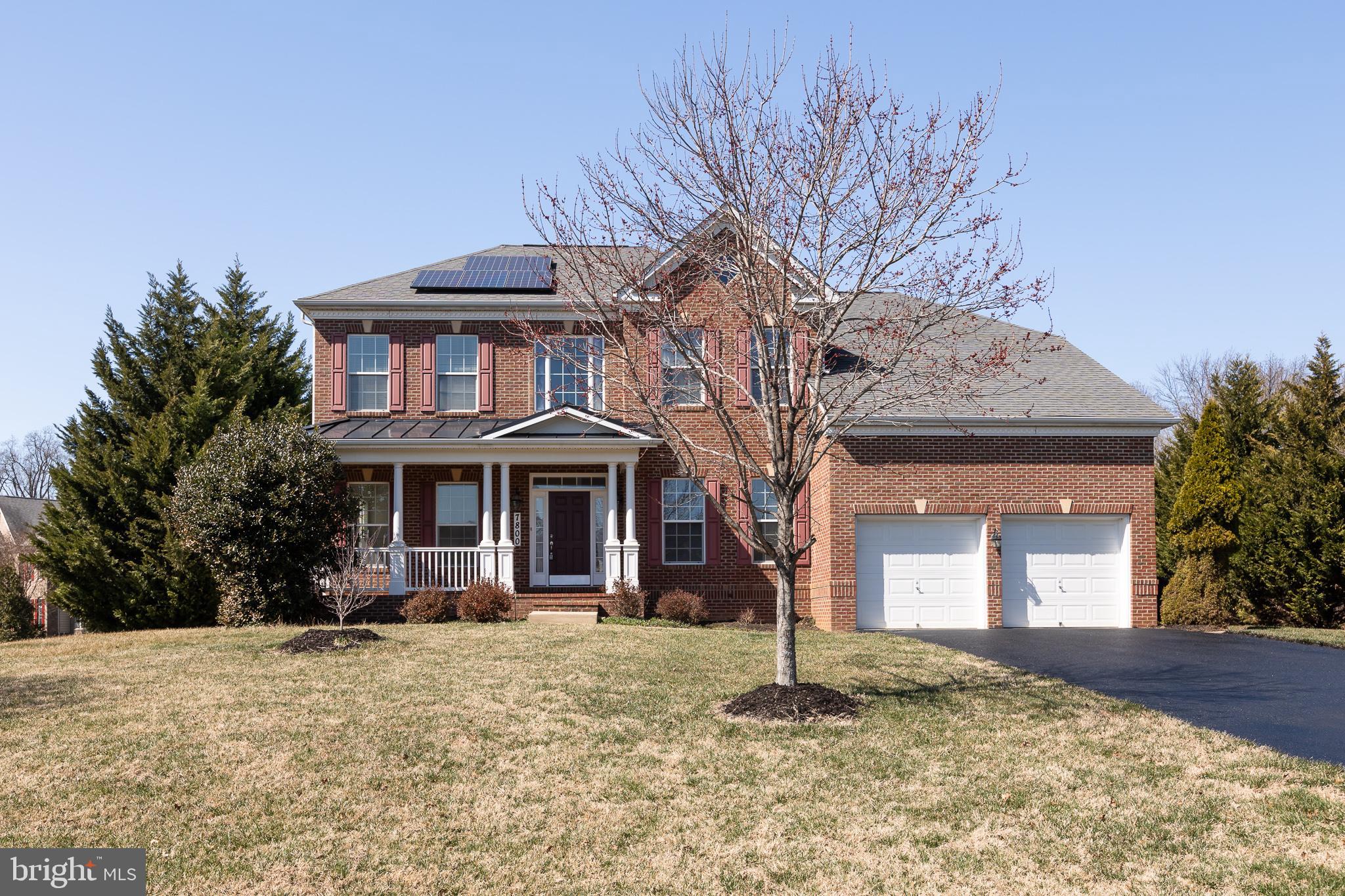 This elegant Colonial-style three-level single-family home sits on a beautifully landscaped 1-acre lot backing to woodland, offering 5 bedrooms, 3 full bathrooms, 1 half bath, a 2-car garage, and 5,094 square feet of finished living space.
A welcoming front porch leads to a dramatic two-story foyer. The main level includes a private office with French doors, ideal for remote work or study. The well-appointed kitchen features granite countertops, stainless steel appliances, custom cabinetry, a spacious walk-in pantry, and a large center island, and opens seamlessly to the morning room and main living areas. The impressive two-story family room with hardwood flooring creates a striking architectural focal point, while dual staircases provide both elegance and convenience when accessing the upper level.
Upstairs, four spacious bedrooms offer comfortable accommodations. The primary suite includes walk-in closets and a generous garden-style bathroom with dual vanities, creating a comfortable private retreat.
The finished walk-up basement expands the home’s living space and includes a guest bedroom, full bathroom, workout room, and custom storage room, making it ideal for extended guests, recreation, hobbies, or flexible multigenerational living.
Outdoor living is a standout feature of the property. A large custom brick patio creates an expansive outdoor entertaining area overlooking the private wooded backyard, perfect for gatherings, outdoor dining, relaxation, or quiet moments enjoying the surrounding natural landscape. A brick walkway connecting the front and backyard adds charm and convenient access to the outdoor living spaces.
A 1-acre homesite in such a convenient location is exceptionally rare, and the property is further distinguished by its thoughtfully designed landscaping. The backyard borders mature woodland, while a row of Leyland Cypress evergreens lines both side boundaries, providing natural privacy while preserving open views of the surrounding forest. From the kitchen, dining room, living room, office, and bedrooms, large windows and sliding glass doors frame peaceful views of trees, flowers, and seasonal colors. With birdsong and occasional wildlife along the woodland edge, the home often feels more like a private park or garden retreat than a typical suburban residence.
Adding significant long-term value, the home features fully owned rooftop solar panels. The system operates through BGE’s net-metering program, greatly reducing monthly electricity costs and often eliminating them entirely during high-production months. When solar production exceeds household usage, surplus electricity is returned to the grid, generating bill credits and occasionally a small payment from the utility. The solar system transfers to the new owner with no lease obligations and includes approximately 22 years of remaining warranty coverage.
The home is located just minutes from NASA Goddard Space Flight Center and offers convenient access—within approximately 6 to 14 minutes’ drive—to Interstate 95, Interstate 495, Baltimore–Washington Parkway, New Carrollton Station (Metro, MARC, and Amtrak), and Greenbelt station (Green Line terminus).
Major regional destinations including Washington, DC, Inner Harbor, and Annapolis are all about a 30-minute drive, providing an ideal balance between peaceful, nature-oriented living and excellent regional connectivity.