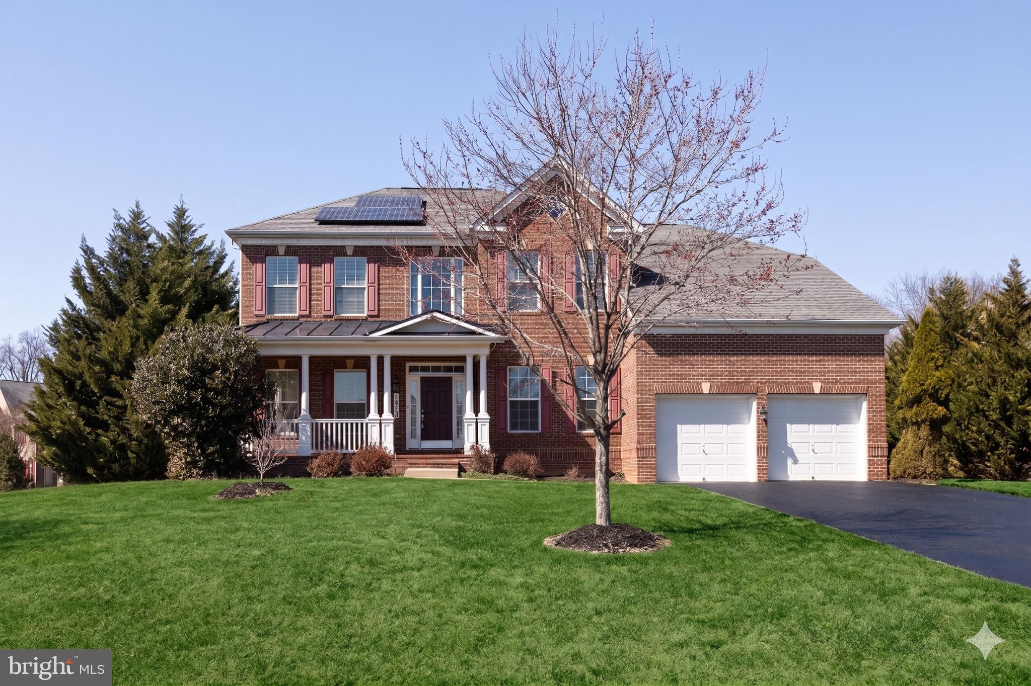This elegant Colonial-style three-level single-family home sits on a beautifully landscaped 1-acre lot backing to woodland, offering 5 bedrooms, 3 full bathrooms, 1 half bath, a 2-car garage, and 5,094 square feet of finished living space.
A welcoming front porch leads to a dramatic two-story foyer. The main level includes a private office with French doors, ideal for remote work or study. The well-appointed kitchen features granite countertops, stainless steel appliances, custom cabinetry, a spacious walk-in pantry, and a large center island, and opens seamlessly to the morning room and main living areas. The impressive two-story family room with hardwood flooring creates a striking architectural focal point, while dual staircases provide both elegance and convenience when accessing the upper level.
Upstairs, four spacious bedrooms offer comfortable accommodations. The primary suite includes walk-in closets and a generous garden-style bathroom with dual vanities, creating a comfortable private retreat.
The finished walk-up basement expands the home’s living space and includes a guest bedroom, full bathroom, workout room, and custom storage room, making it ideal for extended guests, recreation, hobbies, or flexible multigenerational living.
Outdoor living is a standout feature of the property. A large custom brick patio creates an expansive outdoor entertaining area overlooking the private wooded backyard, perfect for gatherings, outdoor dining, relaxation, or quiet moments enjoying the surrounding natural landscape. A brick walkway connecting the front and backyard adds charm and convenient access to the outdoor living spaces.
A 1-acre homesite in such a convenient location is exceptionally rare, and the property is further distinguished by its thoughtfully designed landscaping. The backyard borders mature woodland, while a row of Leyland Cypress evergreens lines both side boundaries, providing natural privacy while preserving open views of the surrounding forest. From the kitchen, dining room, living room, office, and bedrooms, large windows and sliding glass doors frame peaceful views of trees, flowers, and seasonal colors. With birdsong and occasional wildlife along the woodland edge, the home often feels more like a private park or garden retreat than a typical suburban residence.
Adding significant long-term value, the home features fully owned rooftop solar panels. The system operates through BGE’s net-metering program, greatly reducing monthly electricity costs and often eliminating them entirely during high-production months. When solar production exceeds household usage, surplus electricity is returned to the grid, generating bill credits and occasionally a small payment from the utility. The solar system transfers to the new owner with no lease obligations and includes approximately 22 years of remaining warranty coverage.
The home is located just minutes from NASA Goddard Space Flight Center and offers convenient access—within approximately 6 to 14 minutes’ drive—to Interstate 95, Interstate 495, Baltimore–Washington Parkway, New Carrollton Station (Metro, MARC, and Amtrak), and Greenbelt station (Green Line terminus).
Major regional destinations including Washington, DC, Inner Harbor, and Annapolis are all about a 30-minute drive, providing an ideal balance between peaceful, nature-oriented living and excellent regional connectivity.