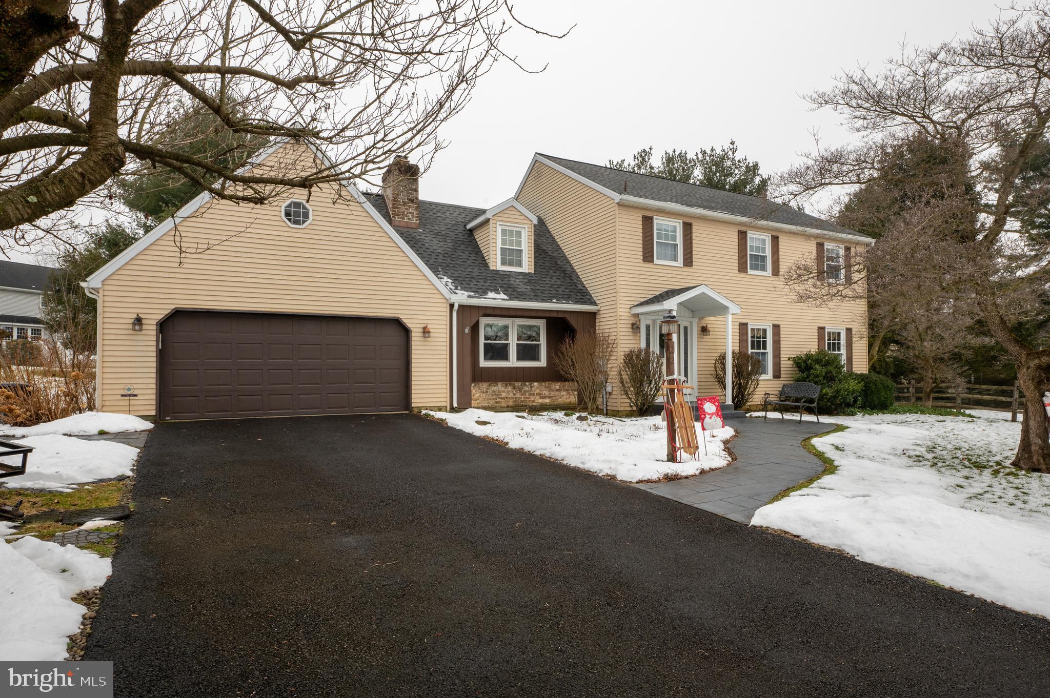 Located on a quiet cul-de-sac in desirable East Penn School District, this 4-bedroom, 2.5-bath Colonial is sure to impress. The welcoming foyer leads into a naturally lit, spacious living room with gorgeous wood flooring and flows into the dining room. The sizable kitchen with bamboo hardwood flooring includes a pantry, plenty of cabinets, stainless appliances, and large eat-in area with sliding doors to a stunning 19x10 covered deck. Relax and unwind in the cozy family room with a fireplace to add warmth and ambiance. Rounding out the first floor is a half bath and a beautiful all-season sunroom with radiant floor heat and access to the backyard and deck. Upstairs, the large primary bedroom offers two oversized closets and an ensuite bathroom. Three more well-sized bedrooms with ample closet space and another full bathroom complete the second floor. The basement provides approximately 570 square feet of finished living space plus a bonus area with laundry and extensive storage. You can enjoy the flat yard from the comfort of the covered back deck, paver patio, or hot tub. With a remodeled kitchen, bathrooms, new roof, and Trex deck, this home is move-in ready. Convenient to major routes and shopping, schedule your showing today!