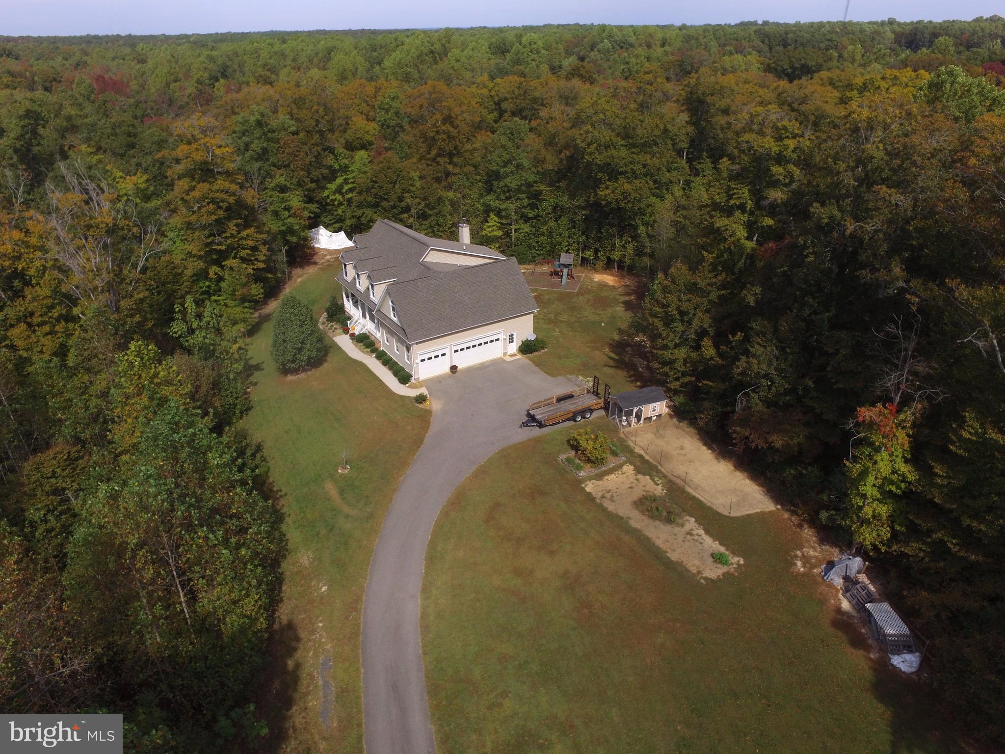 Custom Built Cape Cod on 15 acres!  Main level master suit.  Great room has stone fireplace & wood stove insert. , open 2nd story & hardwood floors.  Cherry cabinets, Corian & ceramic floor in the kitchen.  Anderson windows, 9' ceiling, dual zone HVAC, Bay windows. Huge front porch.  Unfinished basement has extra windows, 9' walls, & rough in plumbing.  Ban board in place for future deck.