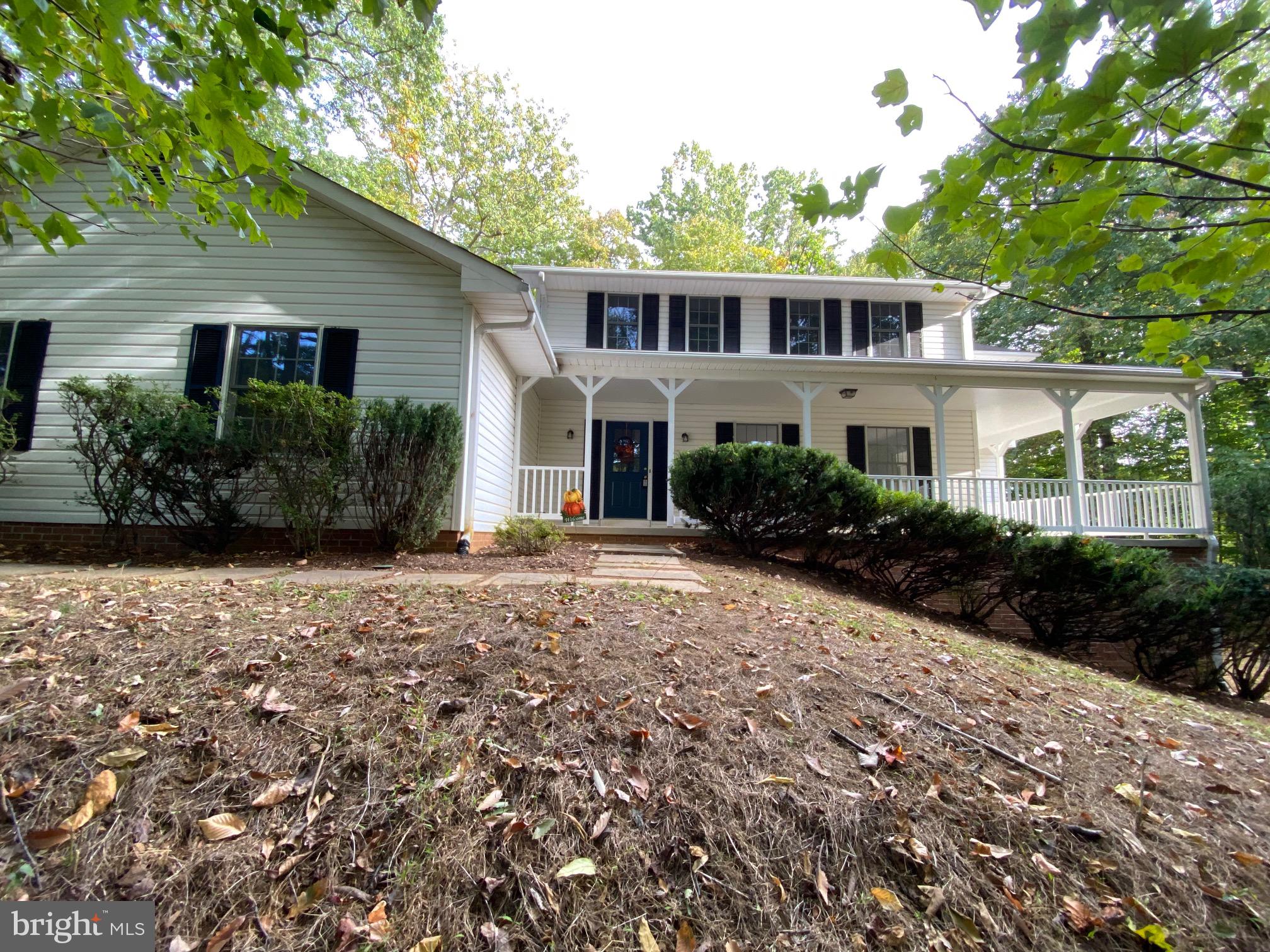 Visit this 'ready-to-move' in home today.   GREAT Location for MARC Train Commuter - less than 2 miles to Point of Rocks Station!!!!    A wonderful PRIVATE wooded setting for this large finished three level colonial.  TOTAL finished sq. ft 3486.        Entire house freshly painted, new carpet and new Luxury Vinyl Tile in the full bathrooms.     UPPER LEVEL has 4 spacious bedrooms. 2 bedrooms have ceiling fans,  2 closets in primary - one is cedar lined, large closet in primary bath with ELFA shelving, primary bath and a hall bath.   MAIN LEVEL:  updated eat-in kitchen, formal living room, formal dining room, family room with brick raised-hearth wood burning fireplace.  laundry/mud room with outside entrance from the driveway and garage, powder room, walk-in pantry with built in ELFA shelving, foyer, and spacious side loading 2 car garage complete the main level. Large wrap around porch on front and right side connects front door to dining room.  Family room and eat-in kitchen have large sliding doors leading to the patio.  LOWER LEVEL has 3 finished rooms; one has a sliding door leading to the side yard; 2 other rooms would be a great office, exercise room, craft room, workshop, media room.... lots of possibilities, also a full bath.  Concrete block room under the front porch could make a great wine cellar.  Tree views from all windows.  FEATURES AND UPDATES:  dual zoned HVAC (2021) serviced (2023);  GE French Door refrigerator (2022), water treatment serviced (2023); chimney cleaned, relined and new cap (2021);  septic tank pumped and inspected (2022); Water Heater (2016),  LeafGuard installed on all gutters;   In-ground "Centricon" termite monitoring/prevention system surrounds home (2003) -  Annual service agreement with vendor valid to  April 2024.  Kitchen includes large capacity under-counter ice maker also a bottle wine chiller.  ELFA shelving in 4 closets.  Present owner uses Verizon FIOS high-speed internet service.   A great location, less than 2 miles to the MARC commuter train to DC as well as Point of Rocks community park and C&O Canal towpath on the Potomac River, also close to shopping in Frederick and Leesburg.  Visit this 'ready-to-move' in colonial home today.