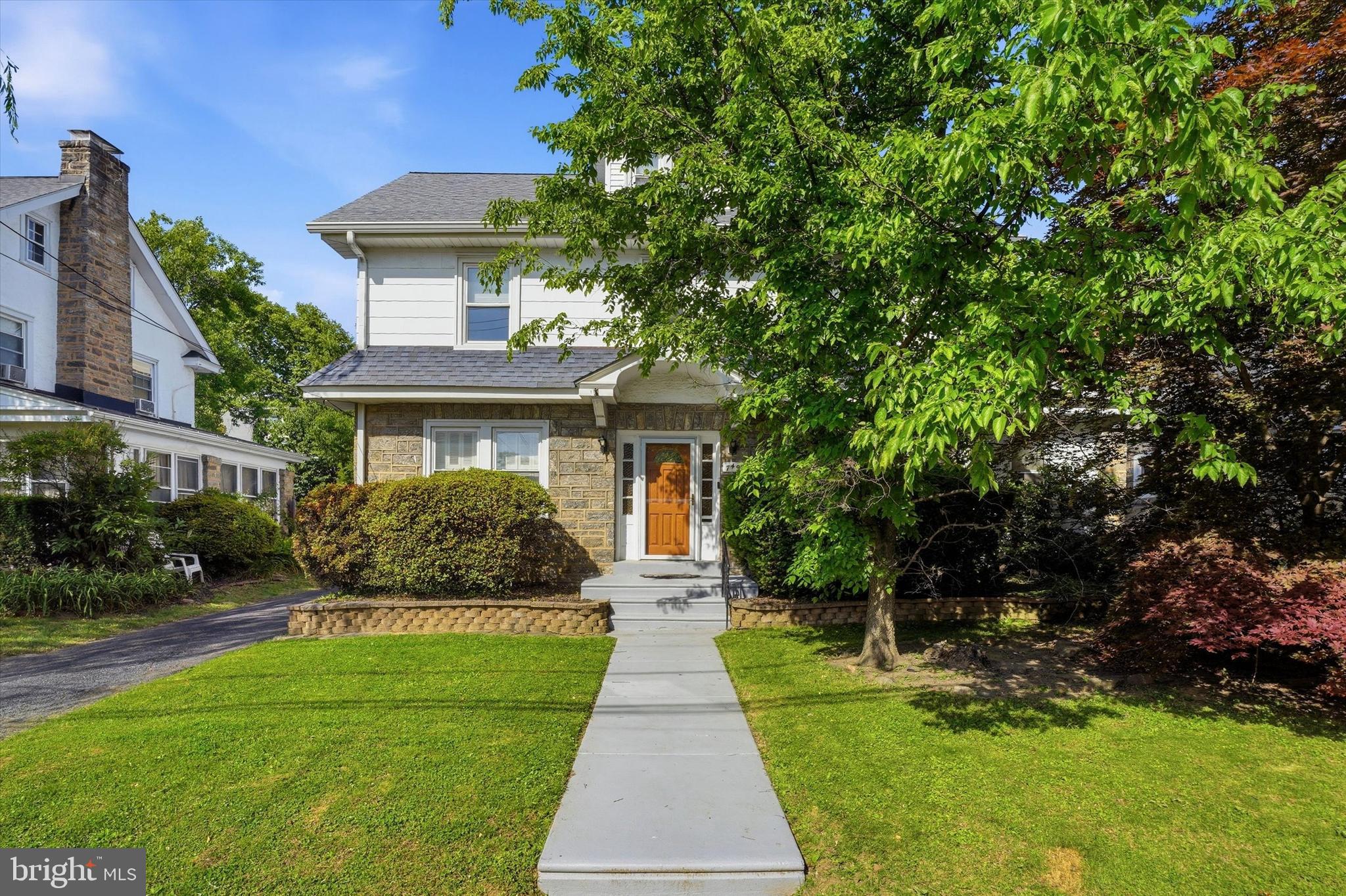 Step into a world of charm and comfort in this beautiful Colonial-style home in Drexel Hill. With 5 spacious bedrooms and 2.5 bathrooms, this residence offers ample space for relaxation and entertaining. The inviting living room boasts a wood-burning fireplace centerpiece, creating a cozy atmosphere for chilly evenings. The open kitchen/dining area includes a separate cooktop and wall oven, upgraded countertops, and tiled backsplash. The breakfast counter and room for a table creates a place for family and friends to gather. Elegant details like chair railings, recessed lighting, and dark hardwood floors add a touch of sophistication. The top floor primary suite features a walk-in closet and a private bath with walk-in shower, ensuring a serene retreat. The remaining 4 bedrooms and hall bathroom with tub shower are on the second level. Step outside to discover a lovely deck overlooking the rear fenced yard, ideal for summer barbecues or quiet mornings with coffee. The property includes a detached garage and driveway parking for multiple vehicles, providing convenience for you and your guests. Don't miss the opportunity to make this enchanting home your own!