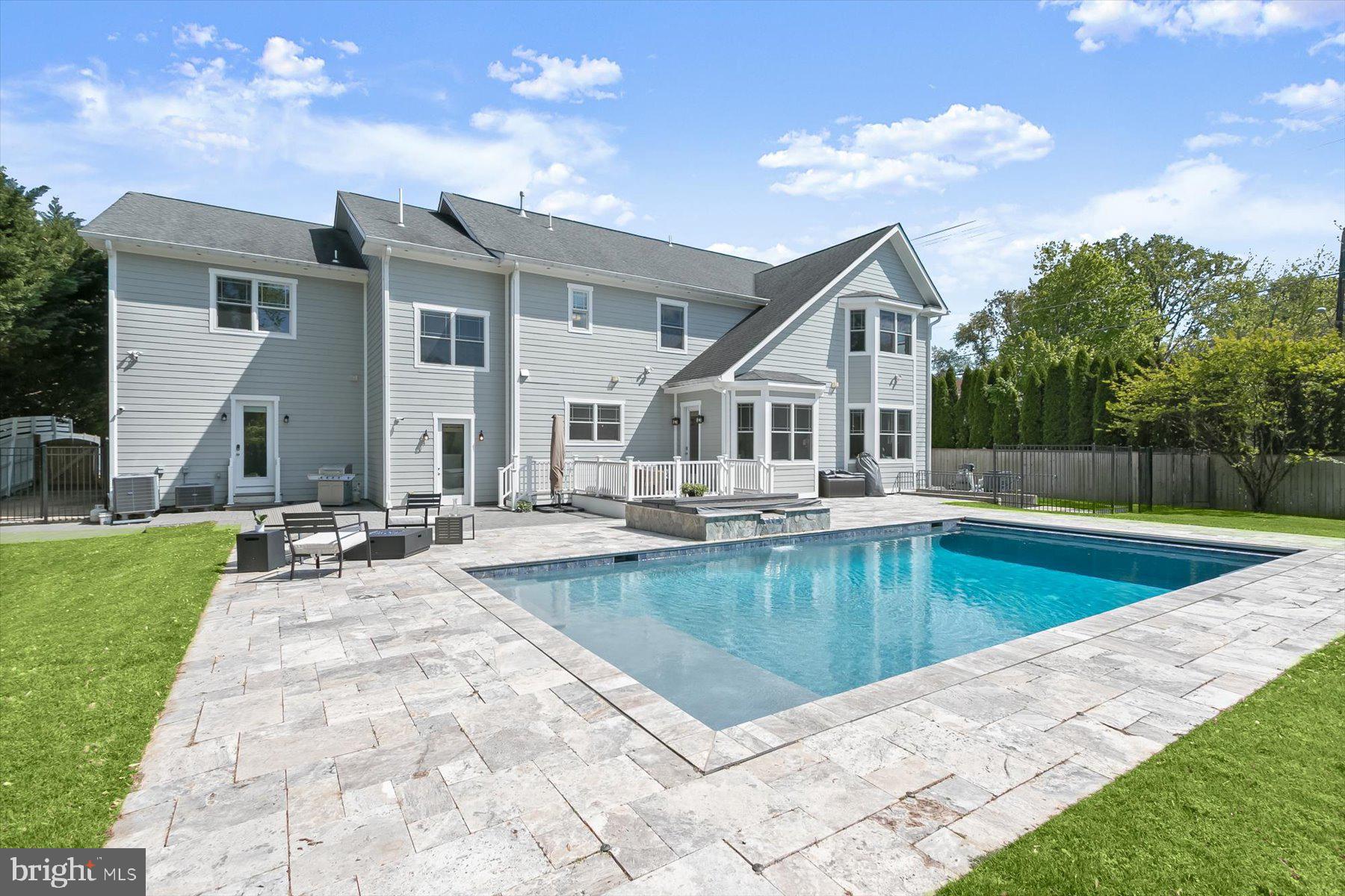 Truly special and elegant home with wonderful woodwork, box and crown molding, coffered ceilings,  solid wood doors and too many custom details to list, flooded with light! Rarely available 5+ bedrooms up and a huge bonus playroom/hangout space on the bedroom level adjoining a bedroom. Wonderful modern design. Backyard oasis with pool with stone tile surround, patio and deck. Possible elevator location. 2 gas fireplaces! Amazing value for 9,200 sq feet of luxurious newer construction in luxmanor. No Expense Spared. Premium Grade Energy Efficient PELLA Windows, Dual Zone High-efficiency HVAC, sound system, recessed lighting, Ten ft ceilings. Designer Chef's Kitchen with stone countertops, Thermador Appliances, breakfast room, mud room. Superb primary suite with spa-like primary bath with soaking tub, large shower with multiple shower heads, WC. Wood floors on main and upper levels. Huge walkout lower level with kitchenette and separate entrance, bedroom, full bath, exercise room, perfect for au pair, in-law suite or possible short term rental. Shopping and Dining at your door! Walk to Wildwood shopping and dining district! Minutes from Downtown Bethesda, Pike & Rose, Strathmore Arts Center,I-270 corridor & I-495.