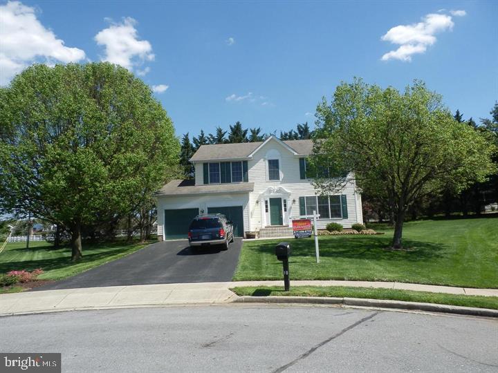 2 Story colonial within walking distance to schools, shopping and restaurants. 3 bedrooms with a Primary Bedroom has an en-suite bath with soaking tub, separate shower, double vanities and large walk-in closet. Two other good size bedrooms with a buddy bath between on the upper level of the home. Main level has an open floorplan, with a large, equipped kitchen with Corian Counters, tile backsplash, wood floors and all of the appliances. Lots of natural light with numerous windows throughout this level. Off the kitchen has a mud room with a pantry and nice front loader washer and dryers and walks out into the double car garage with two separate door openers.  The dining area of the kitchen walks out to a deck with stairs to the back yard. The basement is fully finished with a 3rd full bath a  recreation room and a bonus room. Neither fireplace is part of the rental and are not usable.
