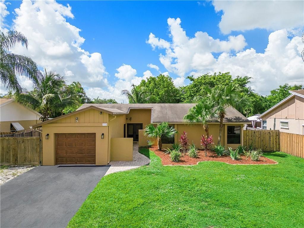 Welcome to your Deerfield Beach Dream Home! This well-maintained & updated 3 bed/2 bath single-family home offers style and functionality. Enjoy the secluded backyard oasis with a resurfaced pool 2020 and custom-built Tiki Bar. Updated chef’s kitchen remodeled in 2019 features Quartz countertops & Quartz farmhouse sink, top-of-the-line appliances, including gas Wolf range, 21 bottle wine fridge, and HUGE island! Roof 2006, Tinted PGT Impact Windows & Doors 2018, Plantation Shutters, Water Heater 2022, & much more! Low HOA of $205/year! Neighborhood Park with Playground, Tennis, Basketball & Boat Ramp. Close to Shopping, Dining, & Movies. 15 min to Deerfield Beach Pier. The devoted upkeep of this home is evident. Embrace comfort, style, and entertainment bliss by making this property yours!