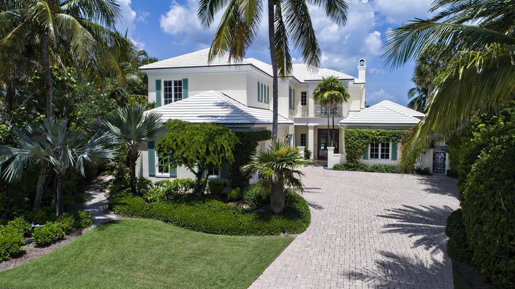 Spectacular waterfront estate. Casual elegance greets guests entering great room featuring floor to ceiling fireplace, coffered ceiling with decorative silver leaf finish. Chef's kitchen with center island features high end appliances & finishes.  Main level master suite is a private oasis; highlights include cherry wood floors, plantation shutters master laundry & luxurious master bath.  5 second floor ensuite guest bedrooms.  Main floor showcases morning room, study & family room. Covered loggia set to entertain; stone floors, fireplace & summer kitchen.  50' salt water lap pool, private dock with 2 lifts; 4,500 lbs. & 16,000 lbs.