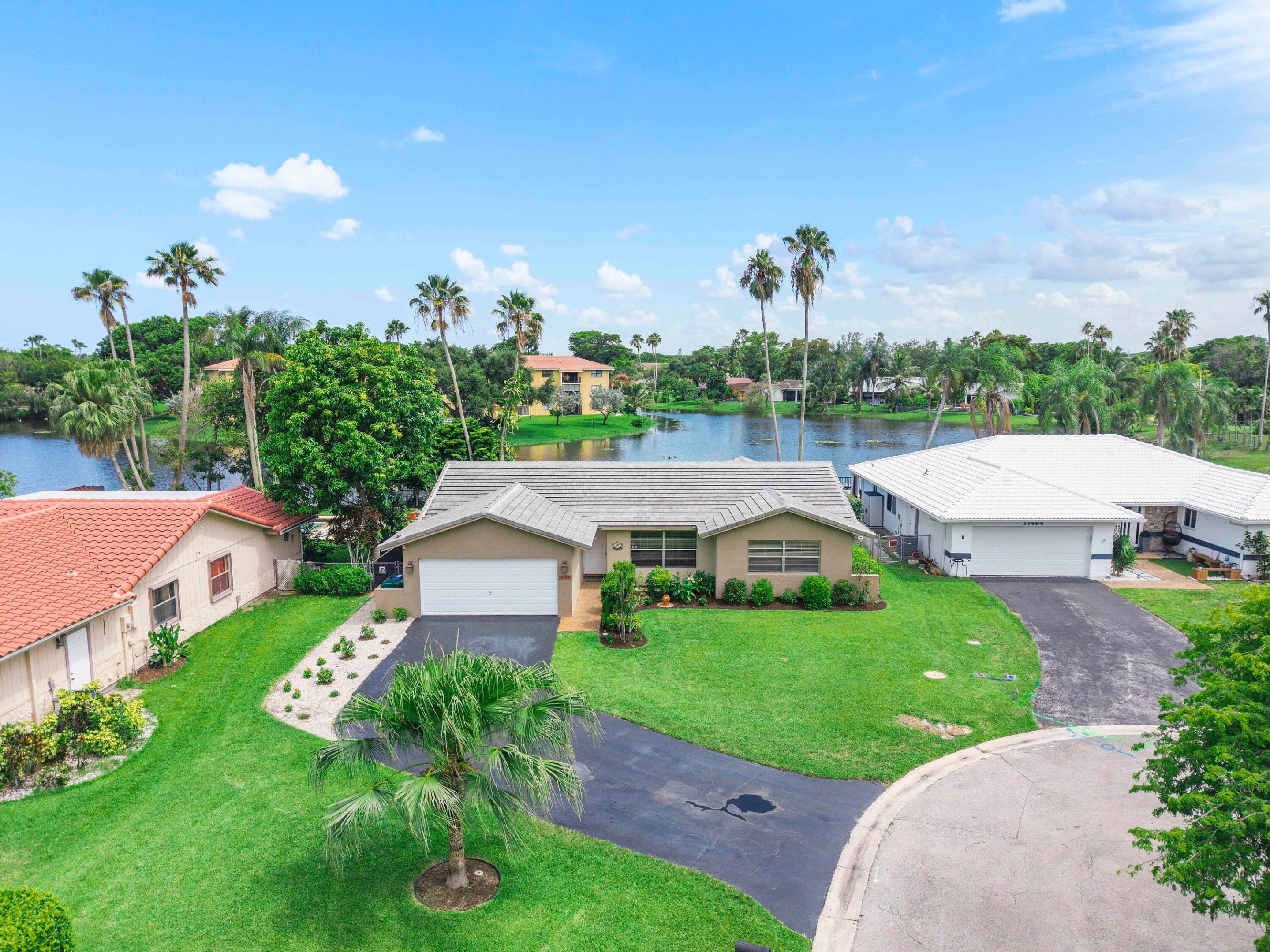 RARE Coral Springs opportunity! This 4/2, NO HOA waterfront home sits on a 10,000+ sq ft lot in a quiet cul-de-sac. Features include a 2024 tile roof, consistent flooring throughout, large backyard, peaceful views, and plenty of parking. A home offering space, privacy, and the lifestyle you've been waiting for. More pictures to come 6/26!